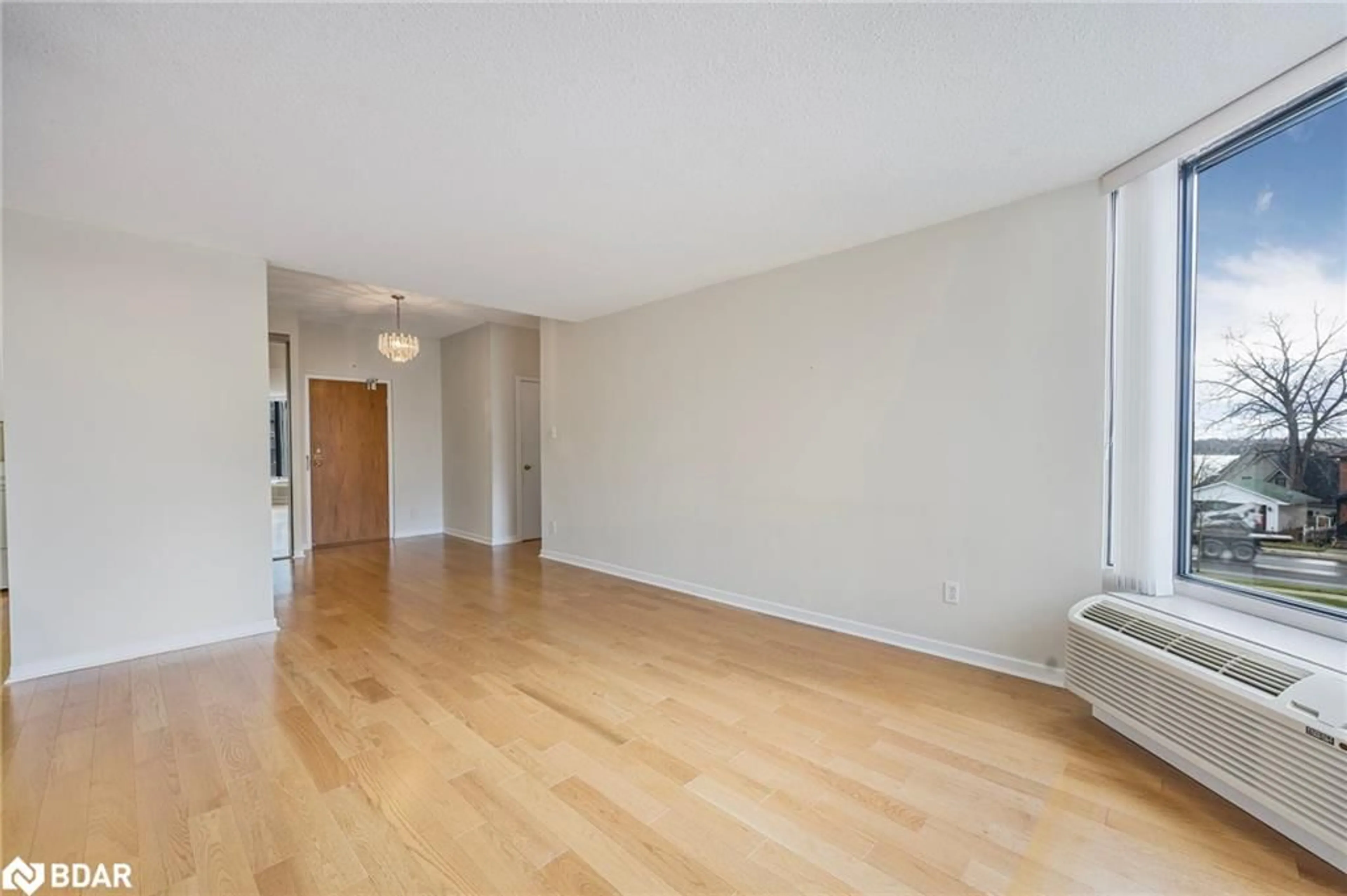 A pic of a room, wood floors for 181 Collier St #104, Barrie Ontario L4M 5L6