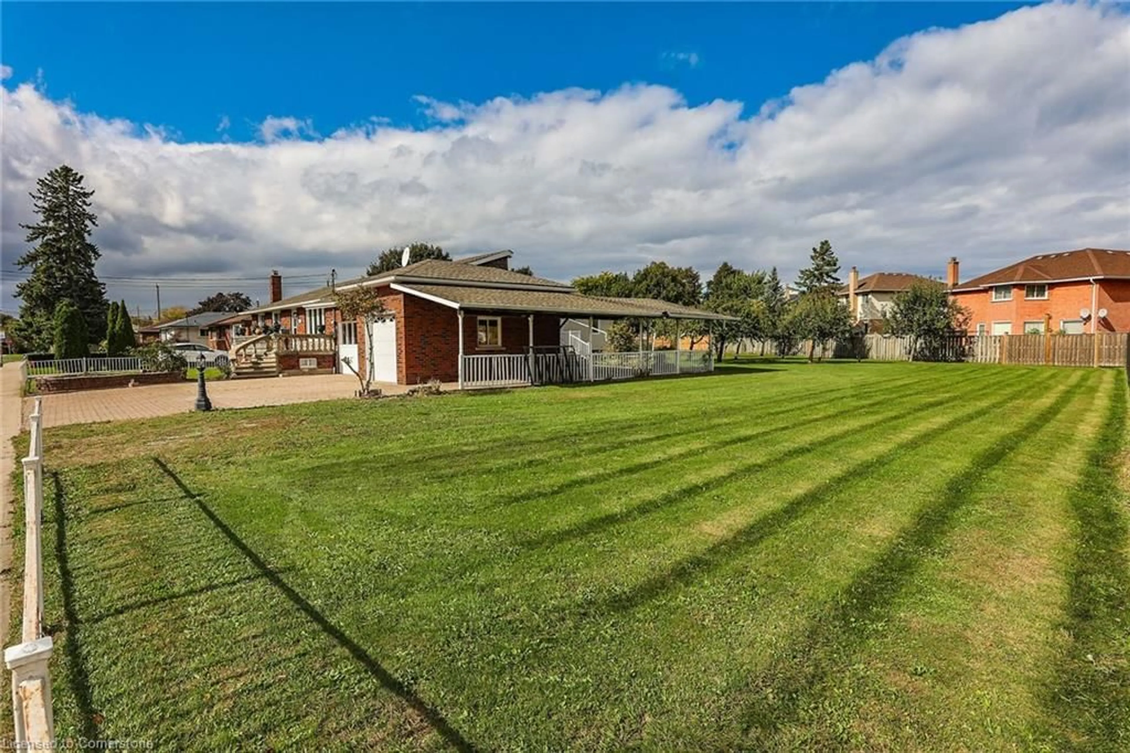 Frontside or backside of a home, the fenced backyard for 171 Britannia Ave, Hamilton Ontario L8E 1T2