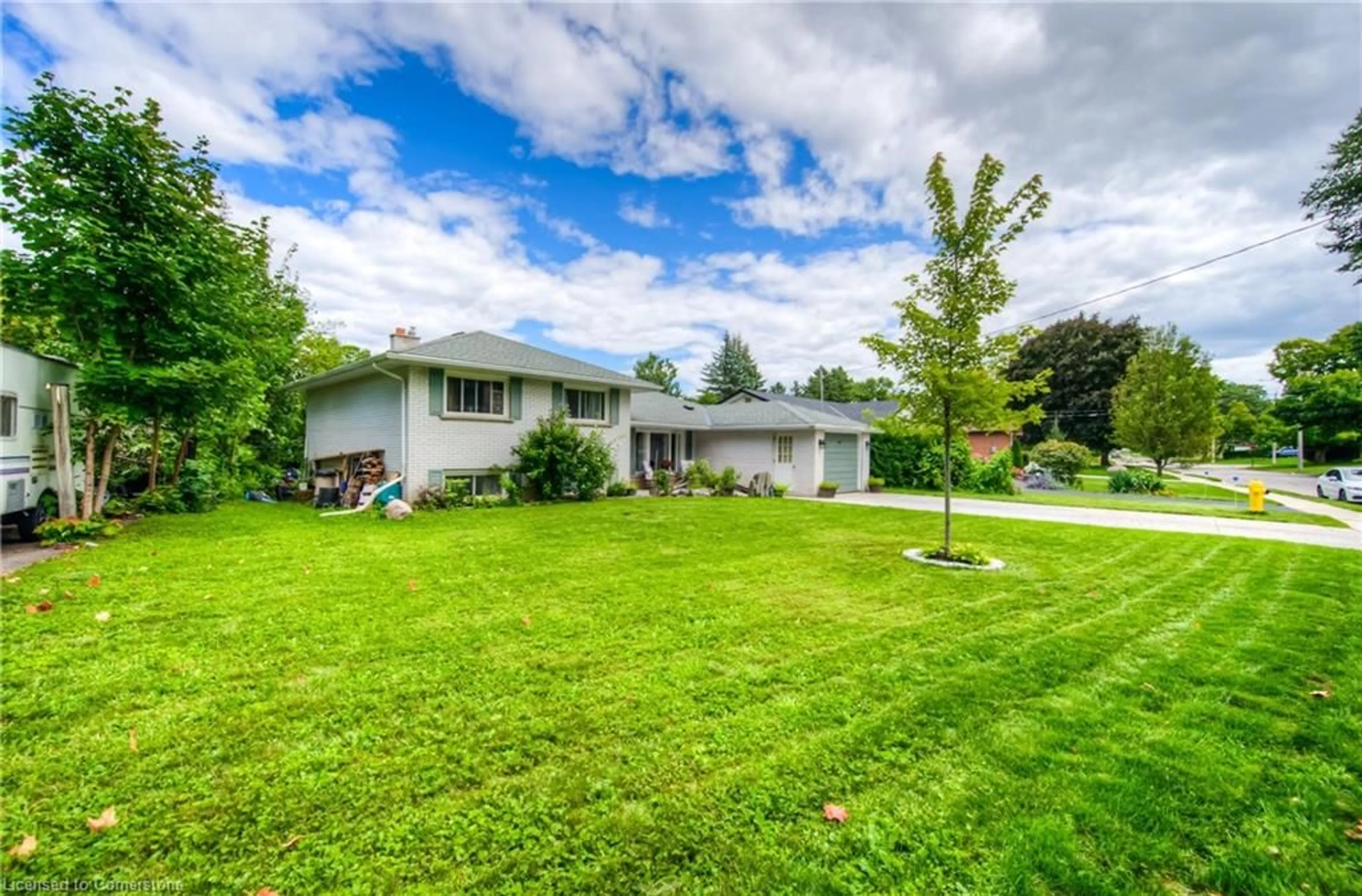 Frontside or backside of a home, the fenced backyard for 8 Gerrard Ave, Cambridge Ontario N3C 2R6