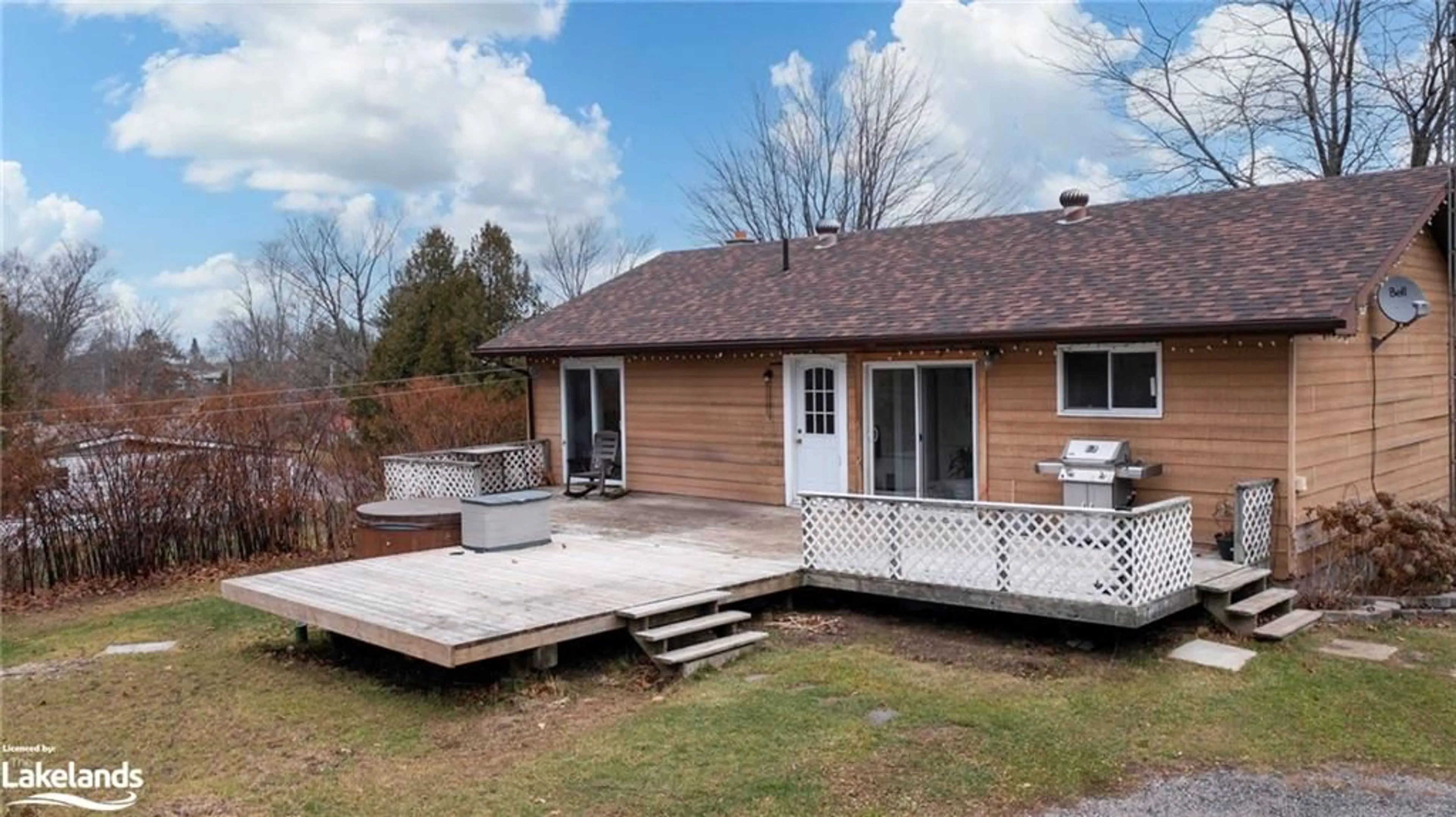 Frontside or backside of a home, the fenced backyard for 263 High Street, MacTier Ontario P0C 1H0