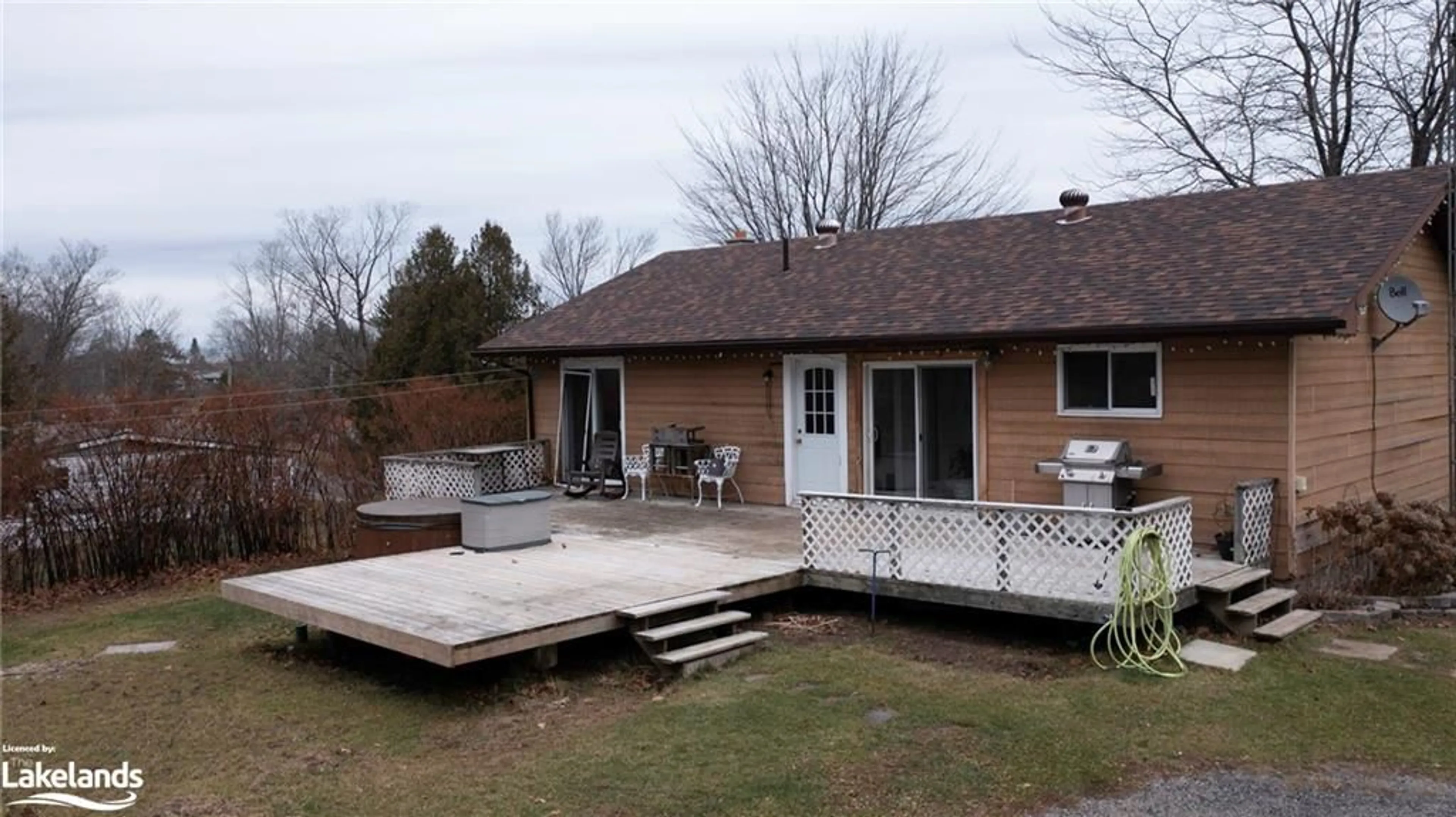 Frontside or backside of a home, the fenced backyard for 263 High Street, MacTier Ontario P0C 1H0