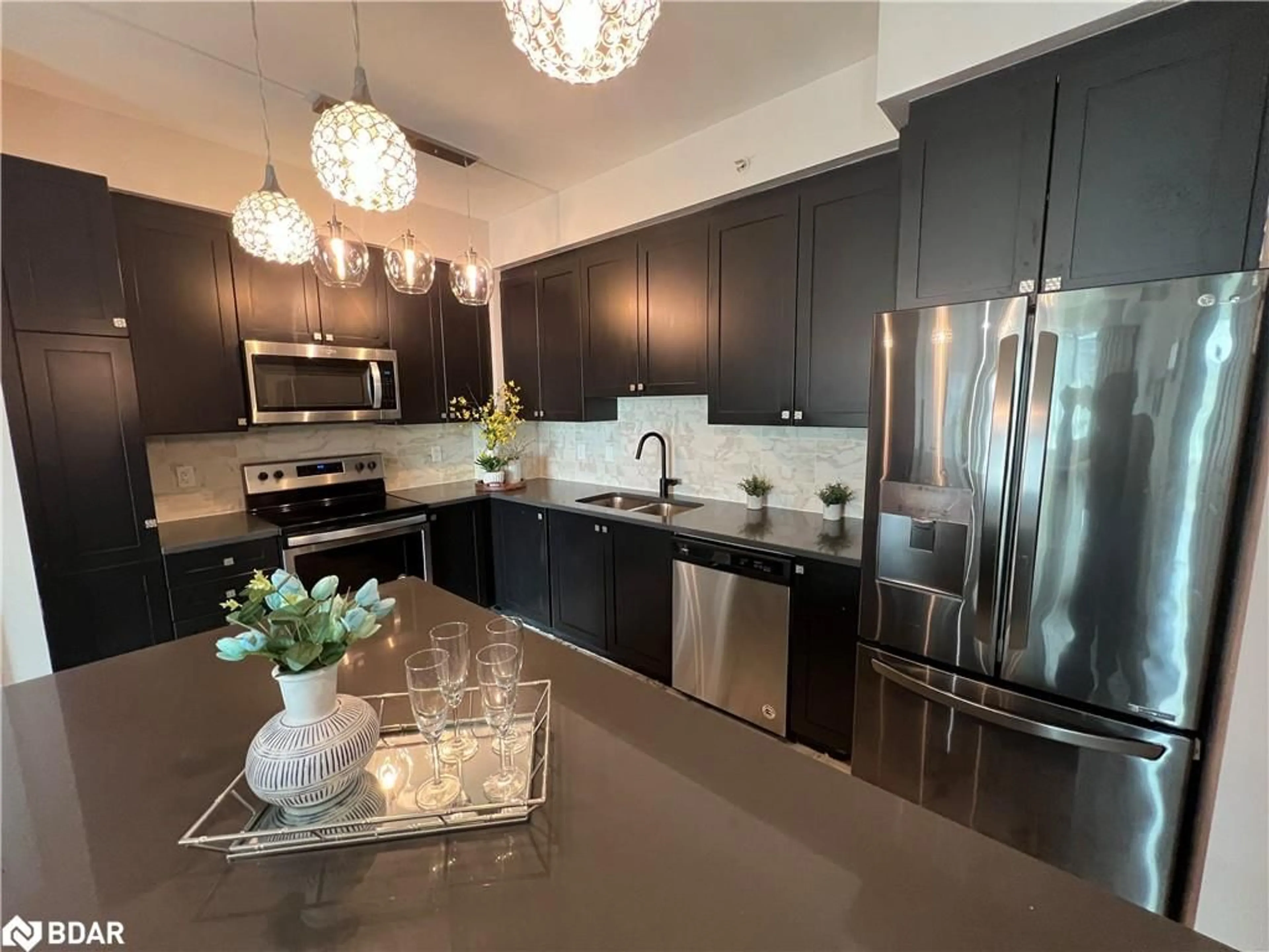 Contemporary kitchen, wood floors for 65 Yorkland Blvd #206, Brampton Ontario L6P 4M5