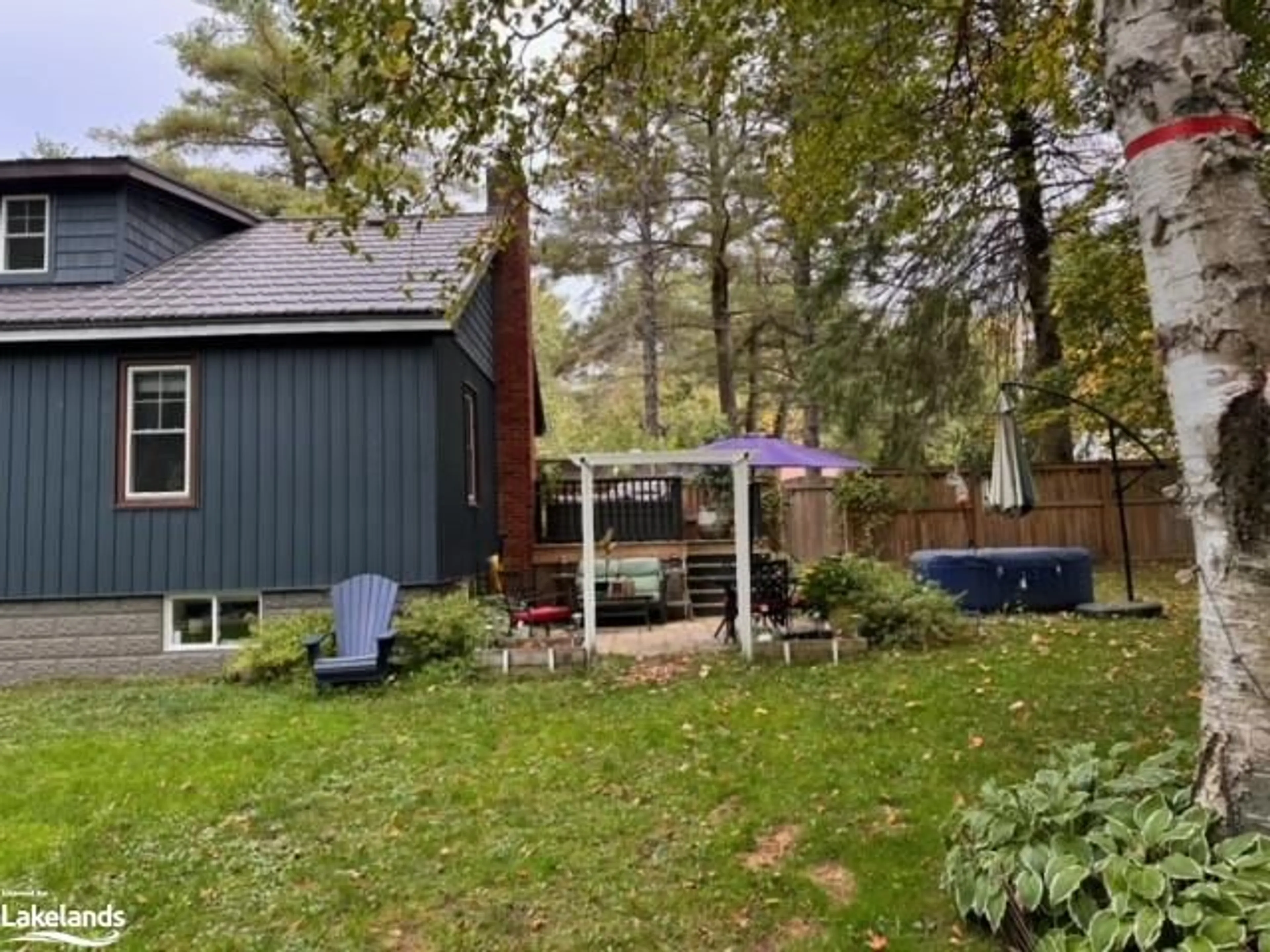 Frontside or backside of a home, the fenced backyard for 390 Manitoba St, Bracebridge Ontario P1L 2C6