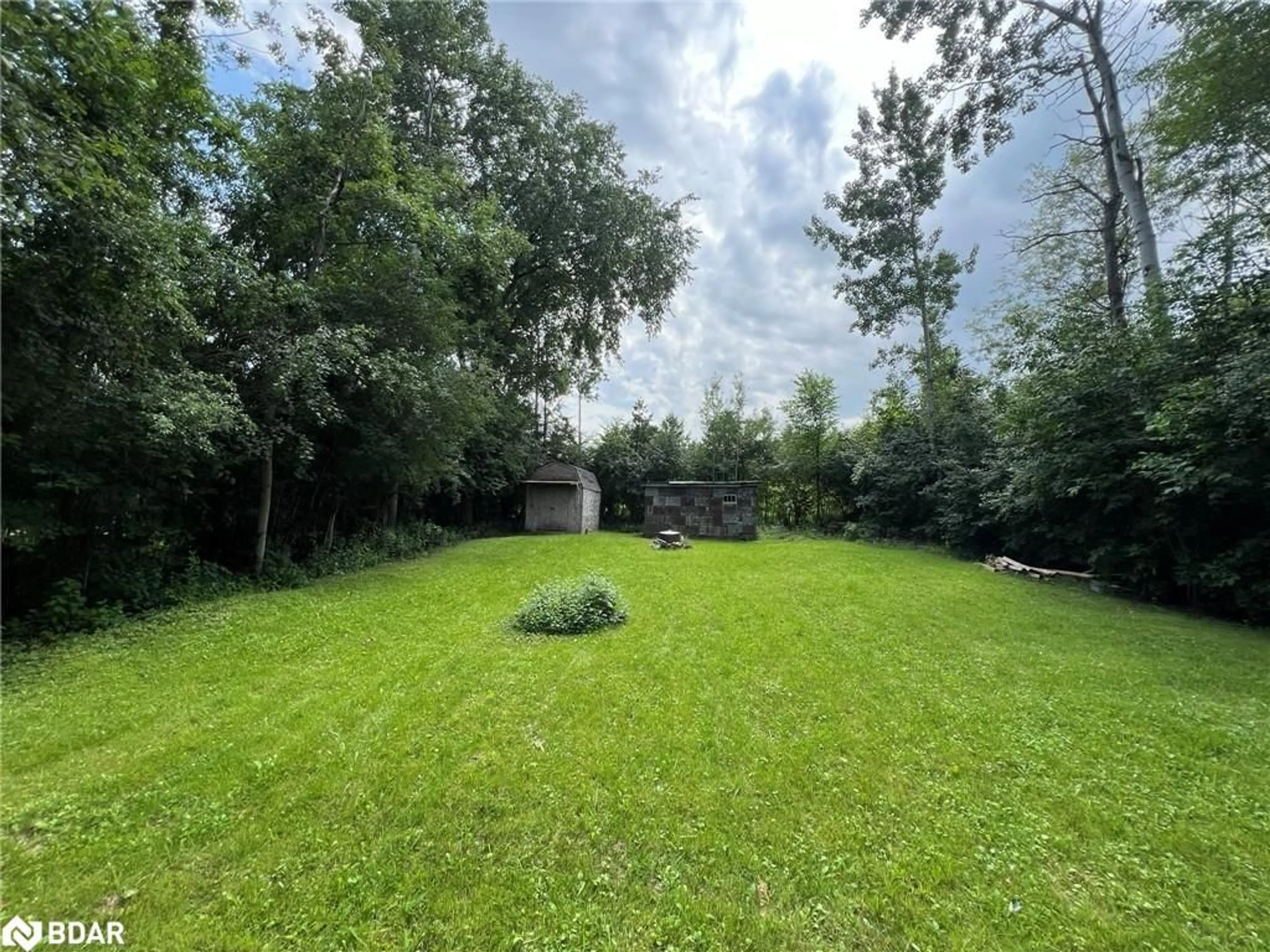 Frontside or backside of a home, the fenced backyard for 34 Broadview St, Collingwood Ontario L9Y 0X2