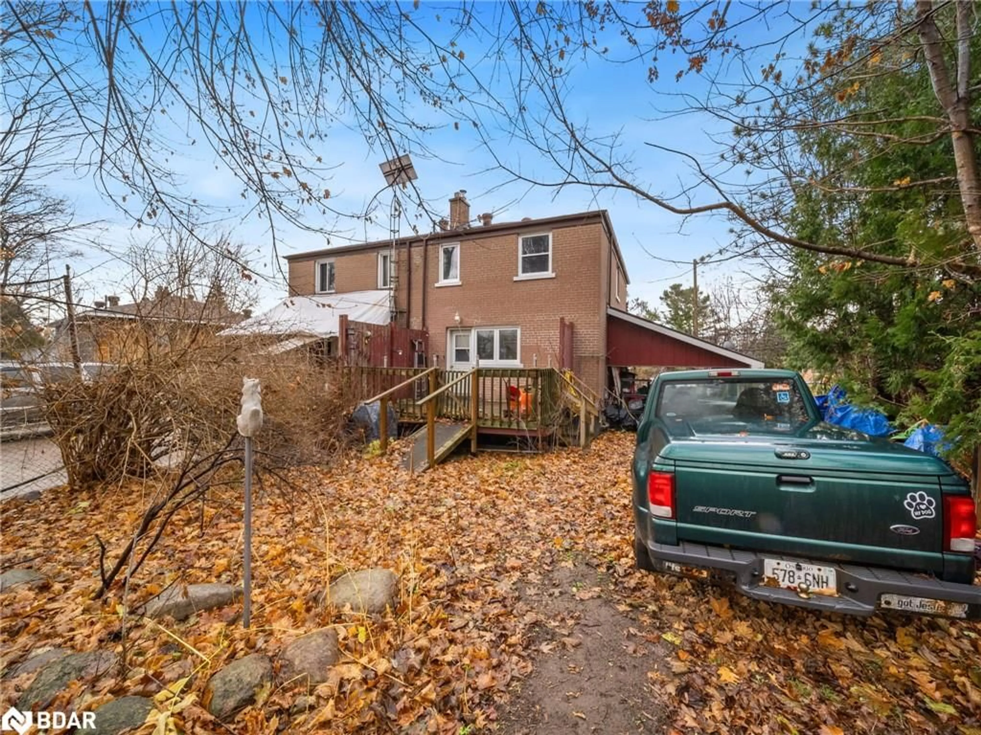 Frontside or backside of a home, the fenced backyard for 30 Sandra Dr, Orillia Ontario L3V 3G7