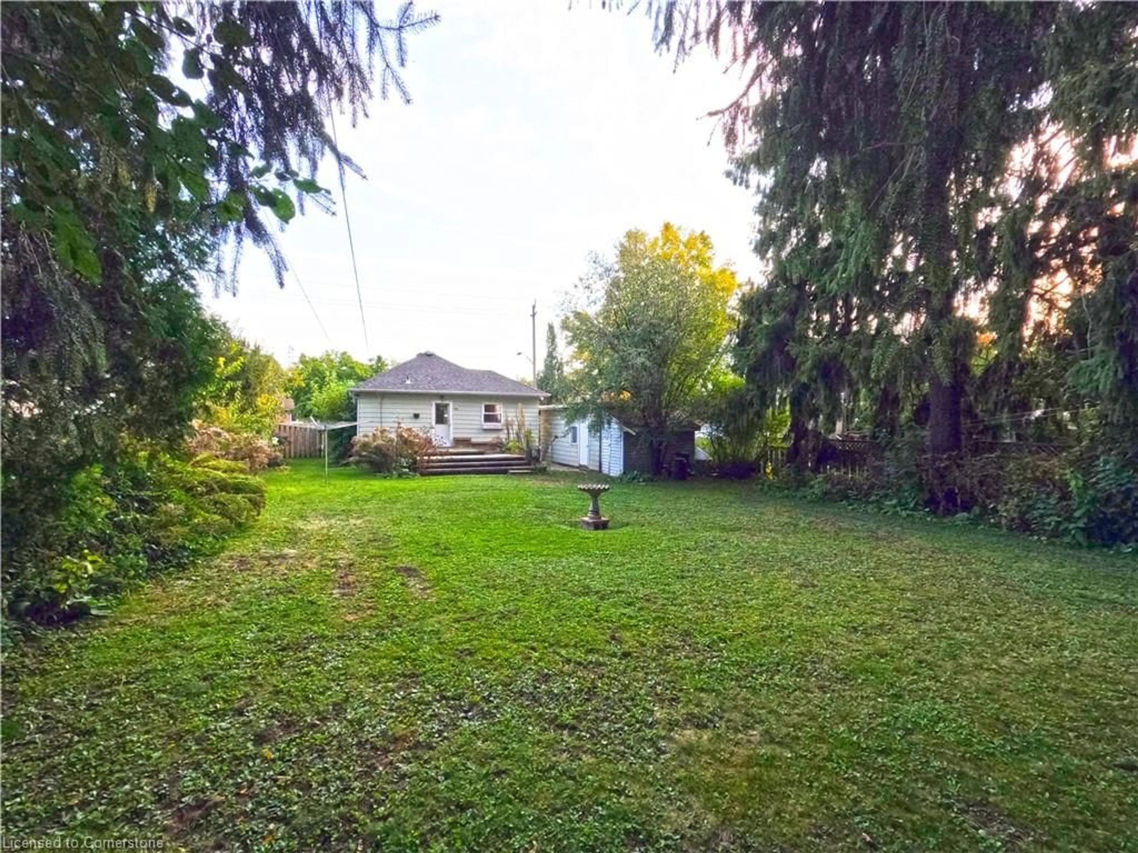 Frontside or backside of a home, the fenced backyard for 173 Canterbury St, Ingersoll Ontario N5C 1E2