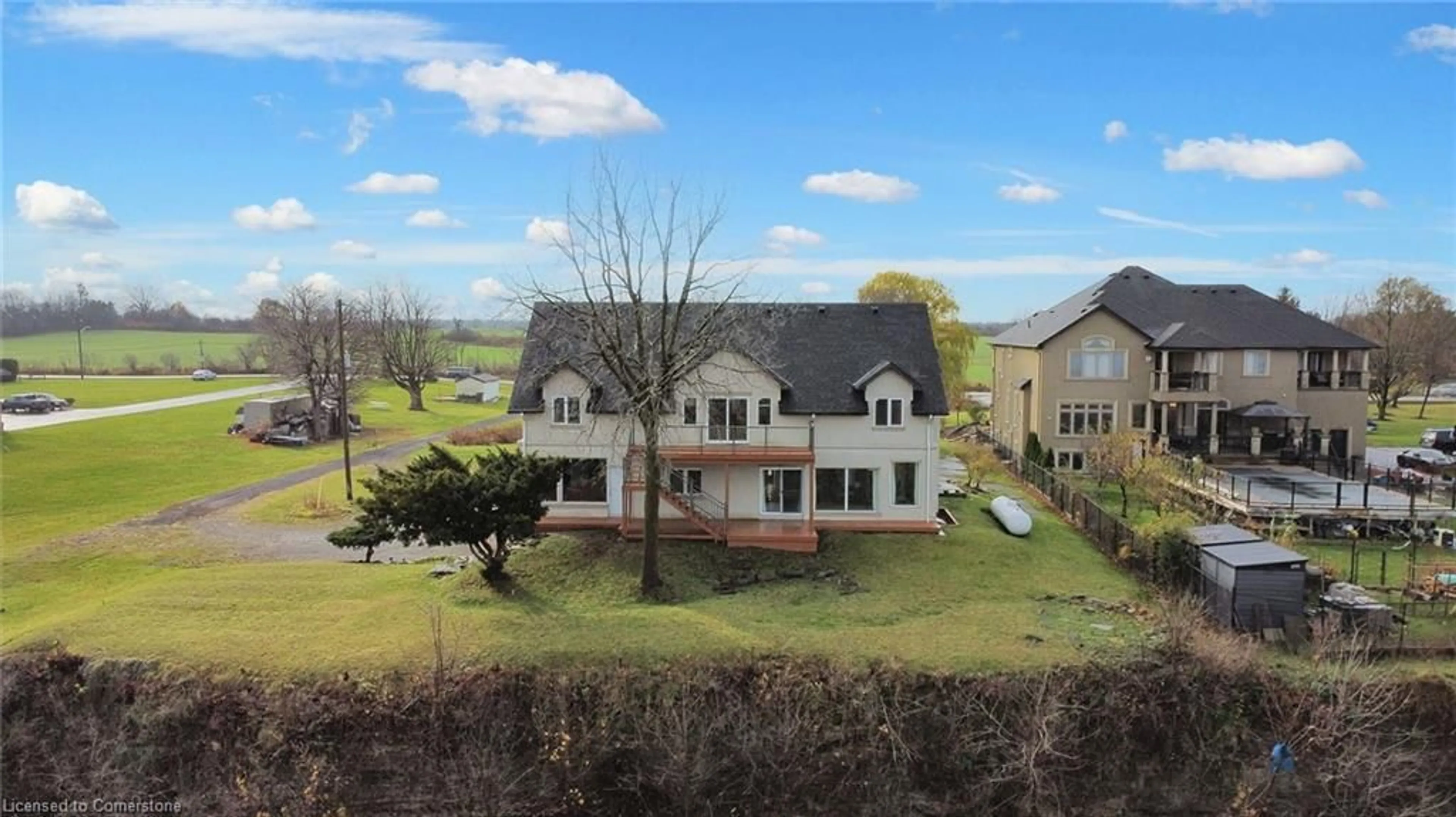 A pic from exterior of the house or condo, the fenced backyard for 827 Ridge Rd, Stoney Creek Ontario L8J 2Y3