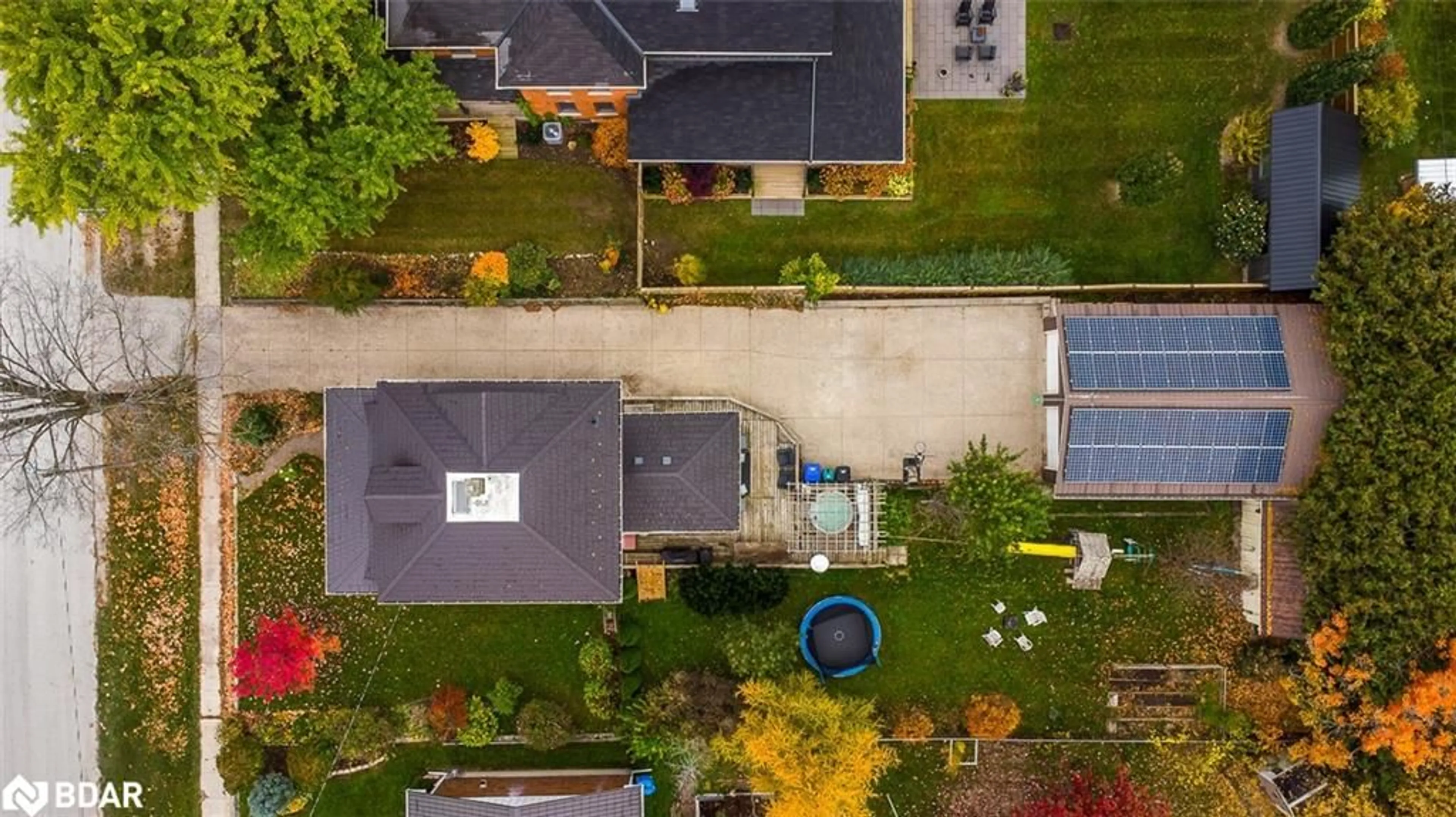 Frontside or backside of a home, the fenced backyard for 12 Elizabeth St, Creemore Ontario L0M 1G0