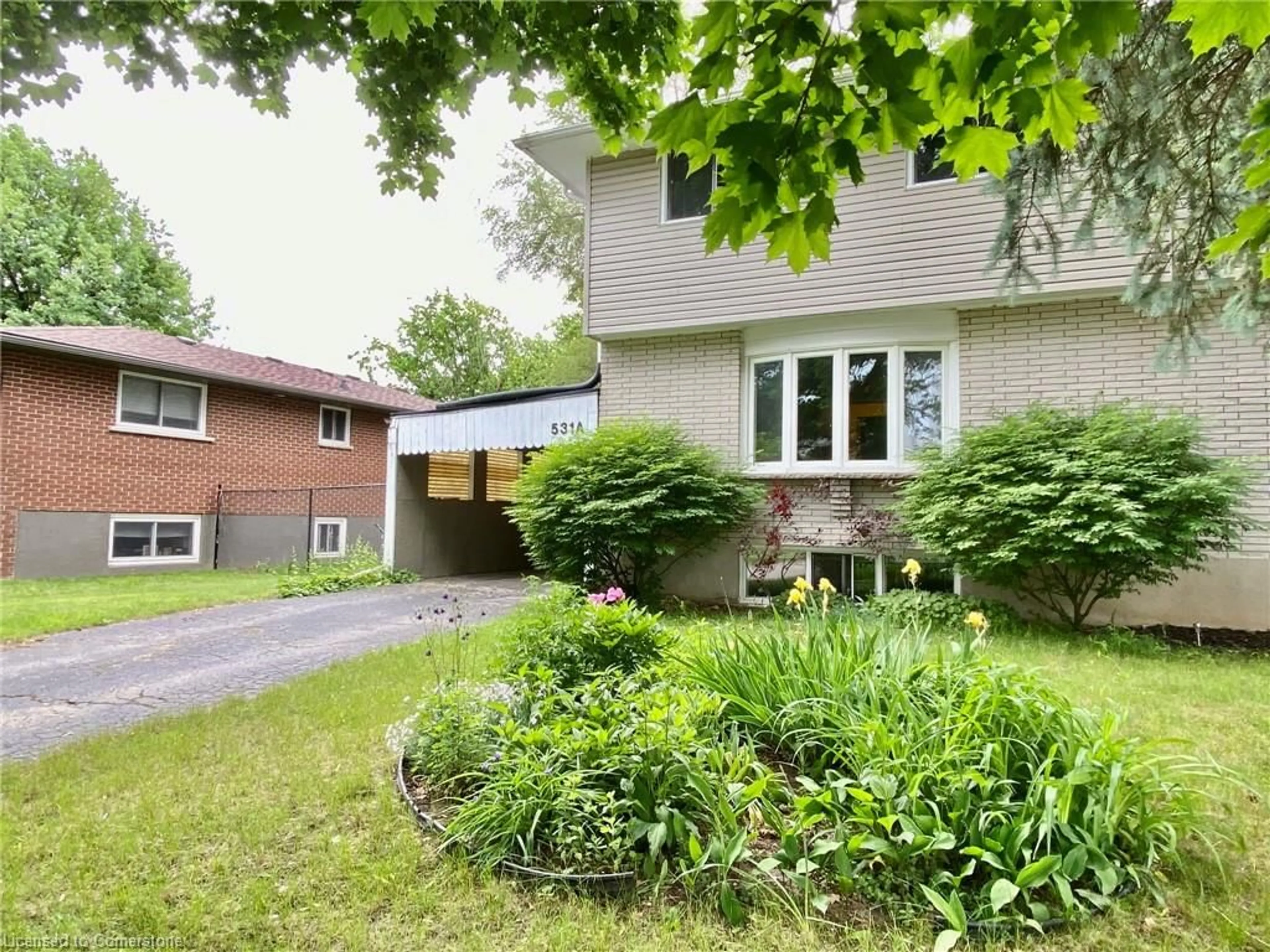 Frontside or backside of a home, the fenced backyard for 531 Brookhaven Cres #A, Waterloo Ontario N2L 4R6