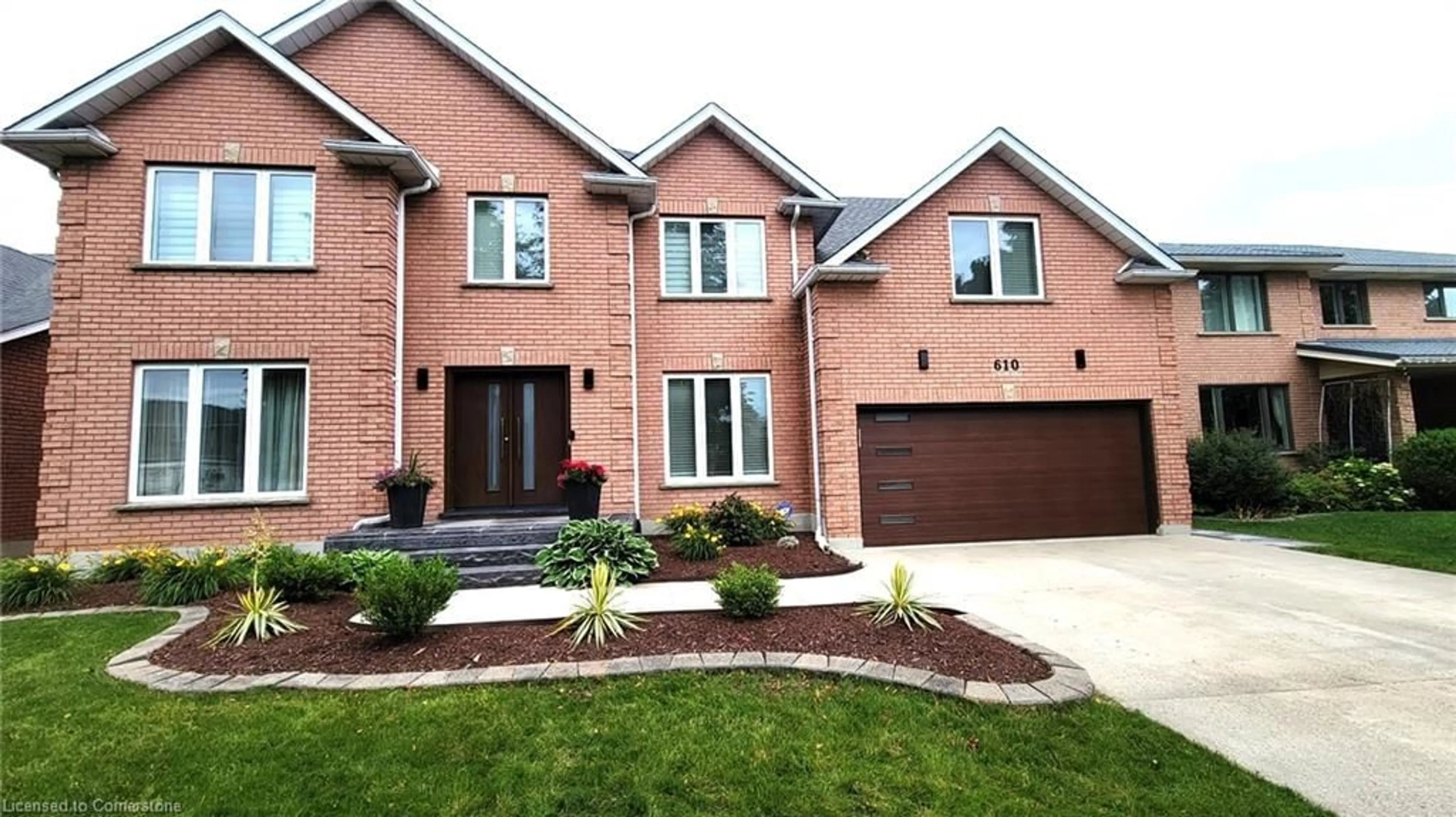 Home with brick exterior material for 610 Stonebury Cres, Waterloo Ontario N2K 3R1