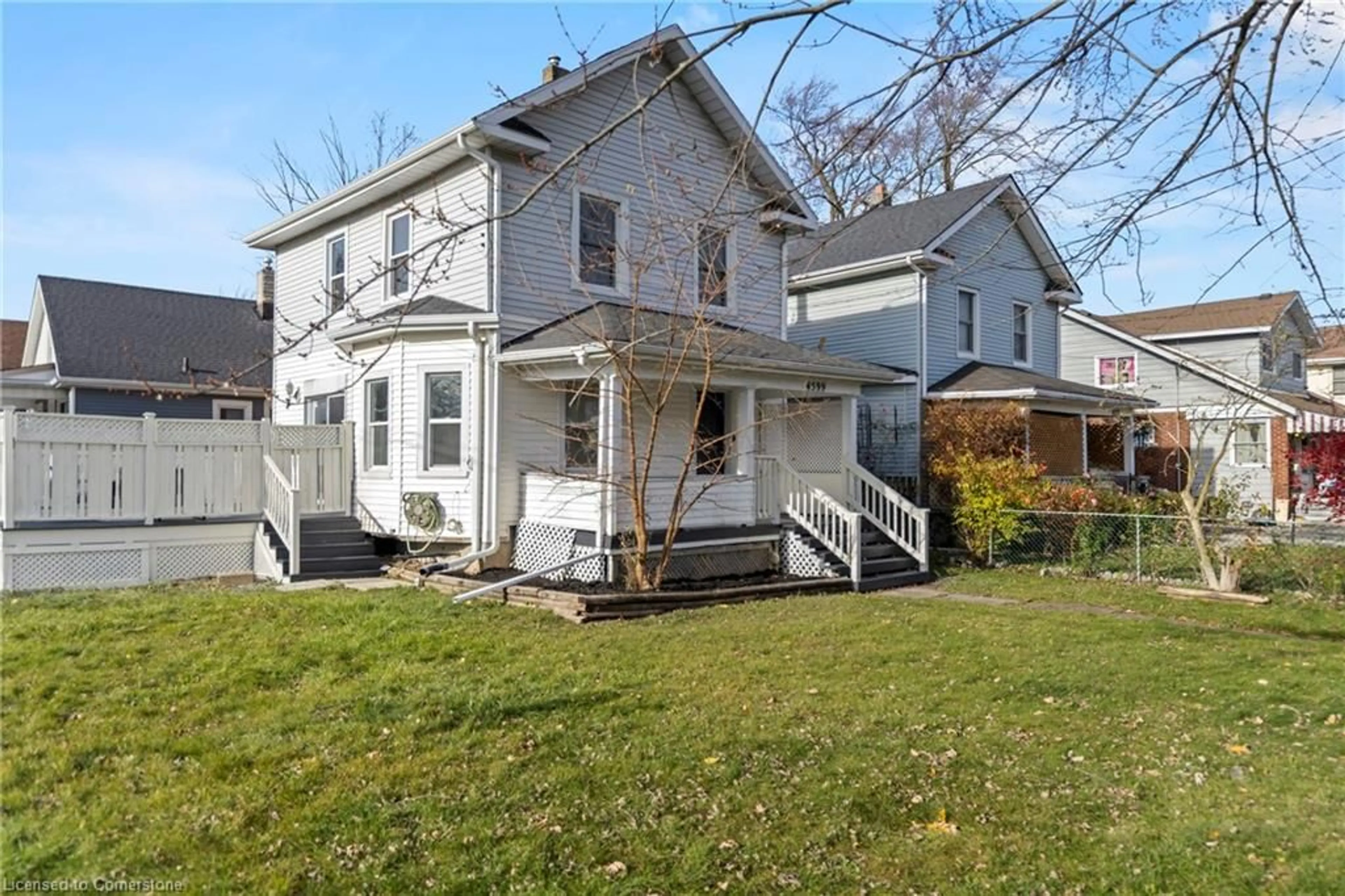 Frontside or backside of a home, the fenced backyard for 4599 Fourth Ave, Niagara Falls Ontario L2E 4N5