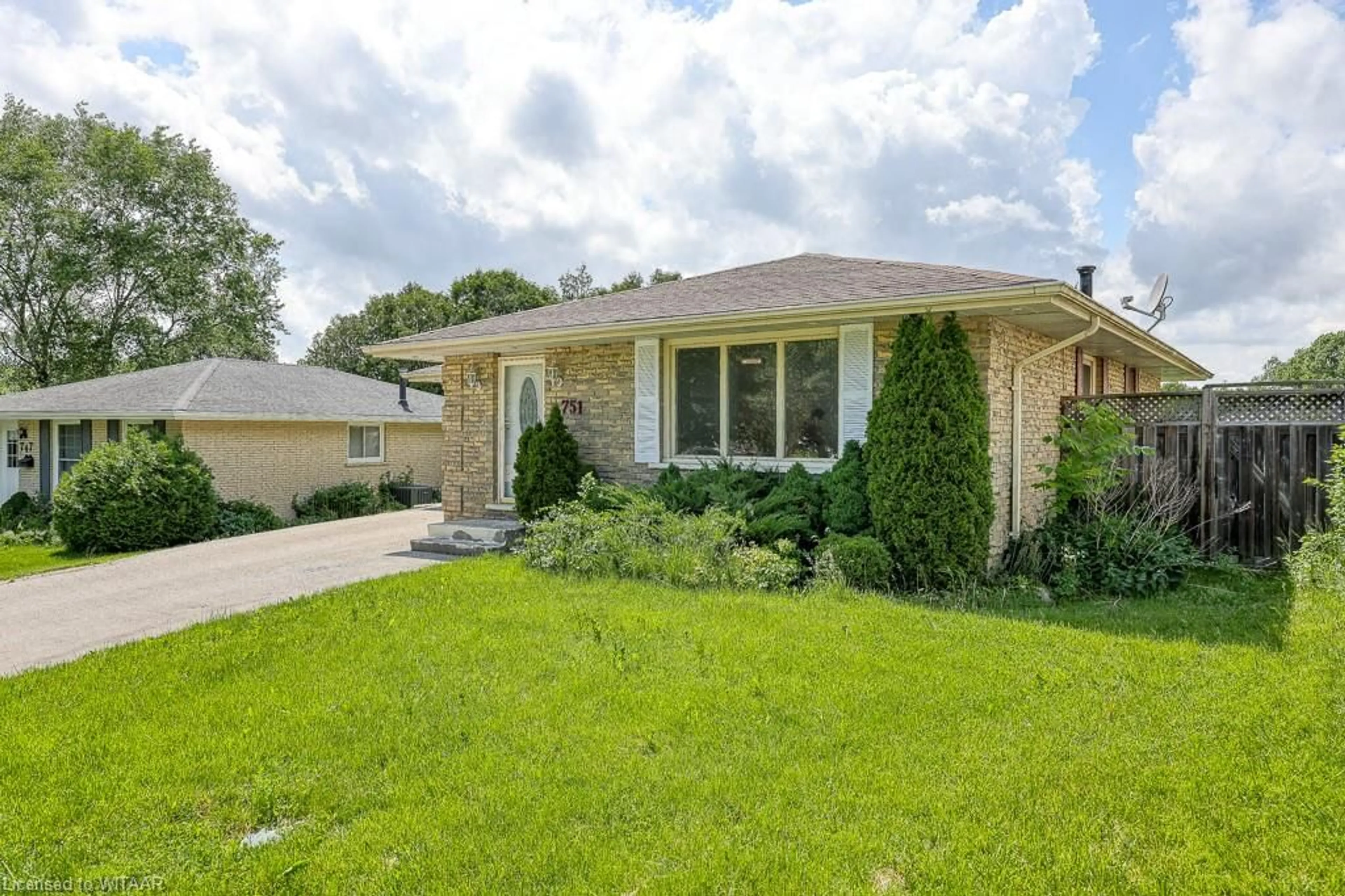 Frontside or backside of a home, the fenced backyard for 751 Boyle Dr, Woodstock Ontario N4S 8M1