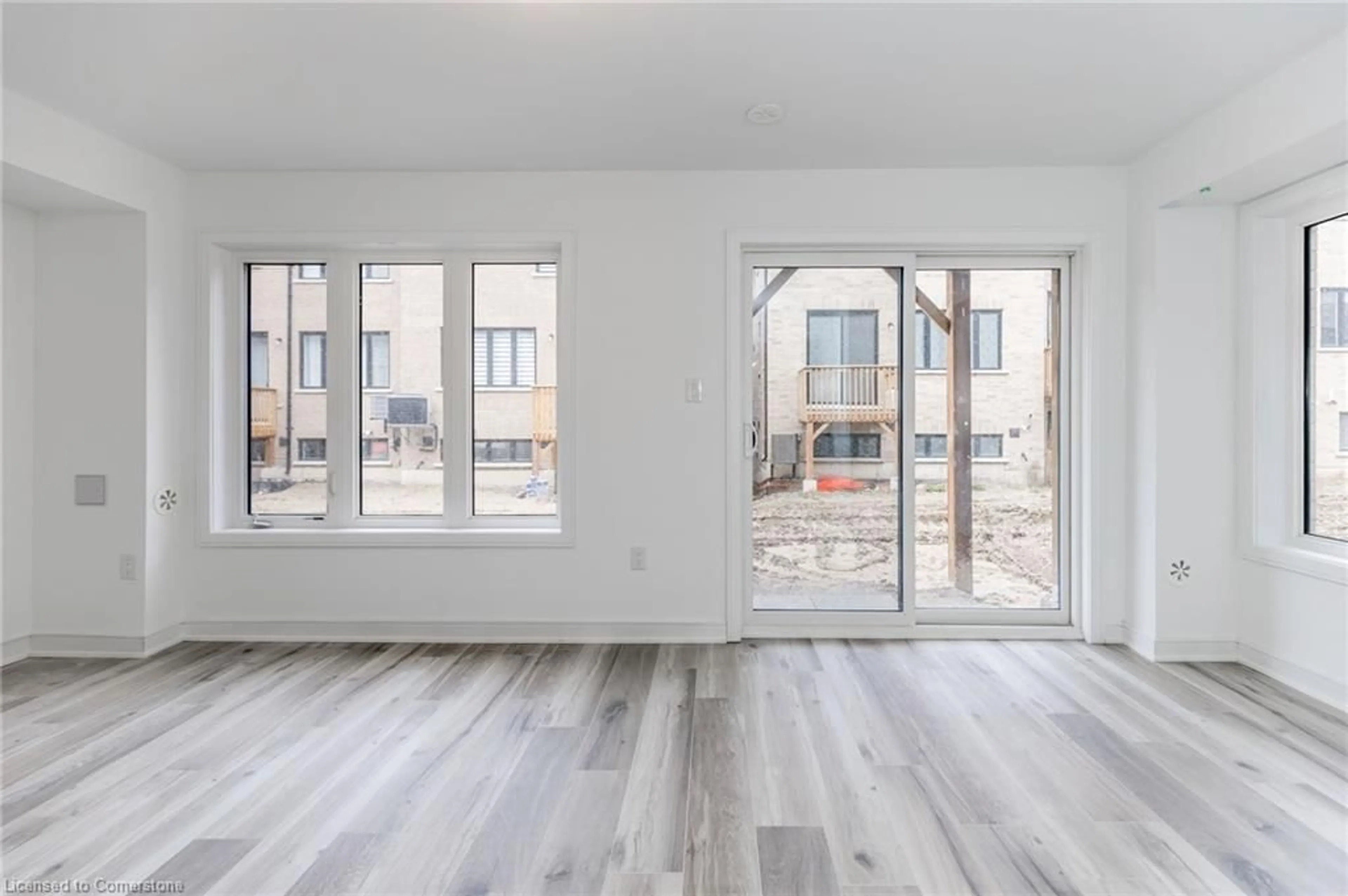 A pic of a room, wood floors for 61 Red Maple Lane, Barrie Ontario L4M 7J6