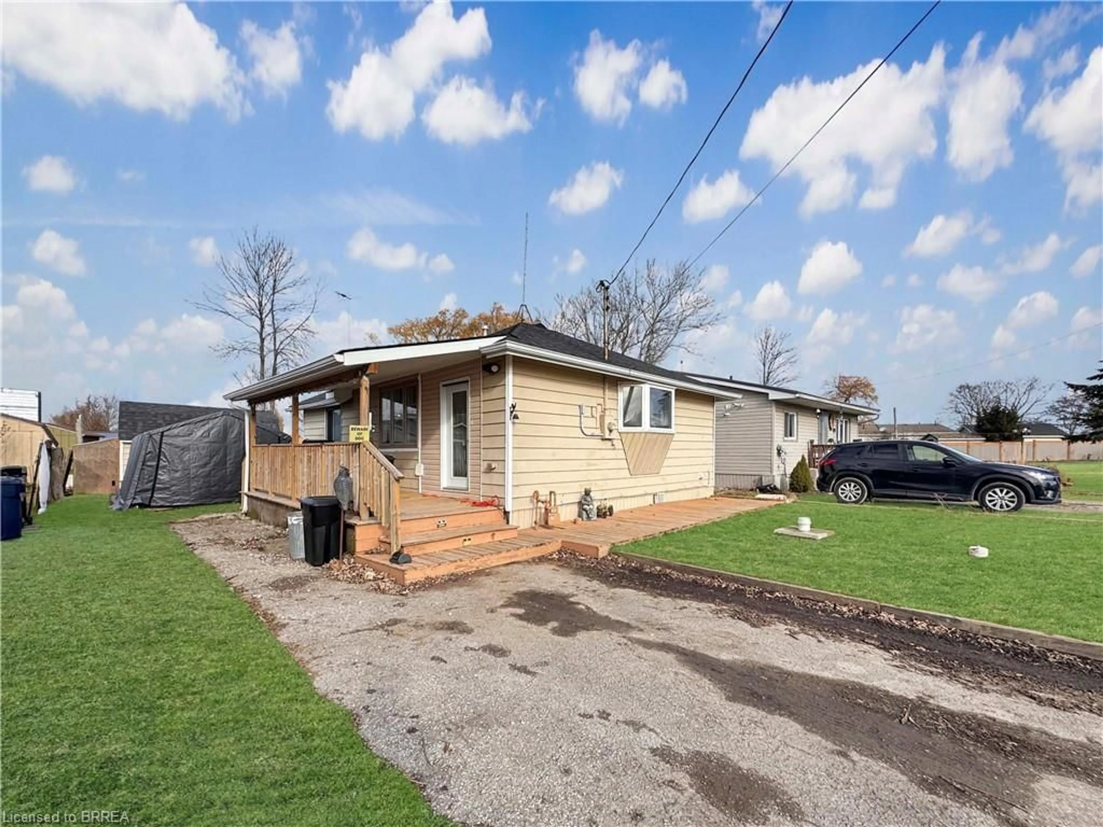 Frontside or backside of a home, the fenced backyard for 6 Beverly Dr, Peacock Point Ontario N0A 1L0