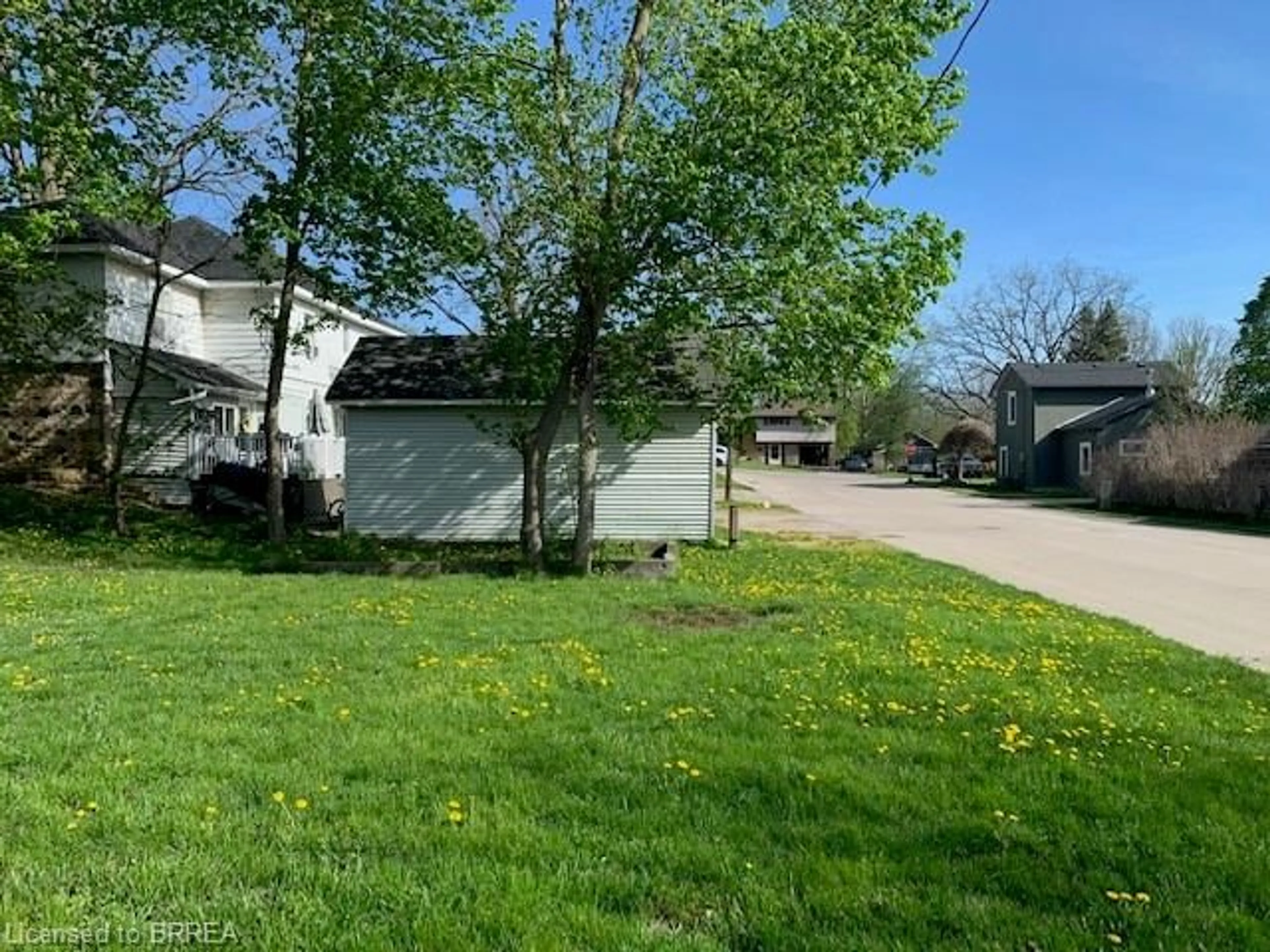 Frontside or backside of a home, the fenced backyard for 7 Cross St, Paris Ontario N3L 1Z8