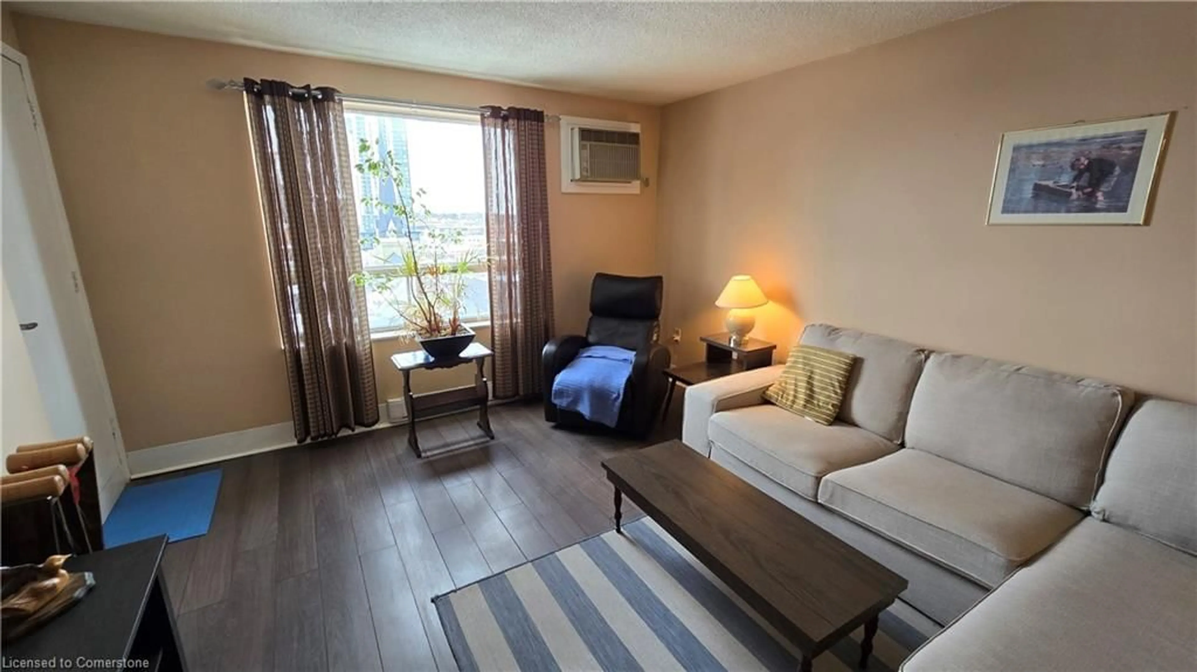 Living room, wood floors for 64 Benton St #703, Kitchener Ontario N2G 4L9