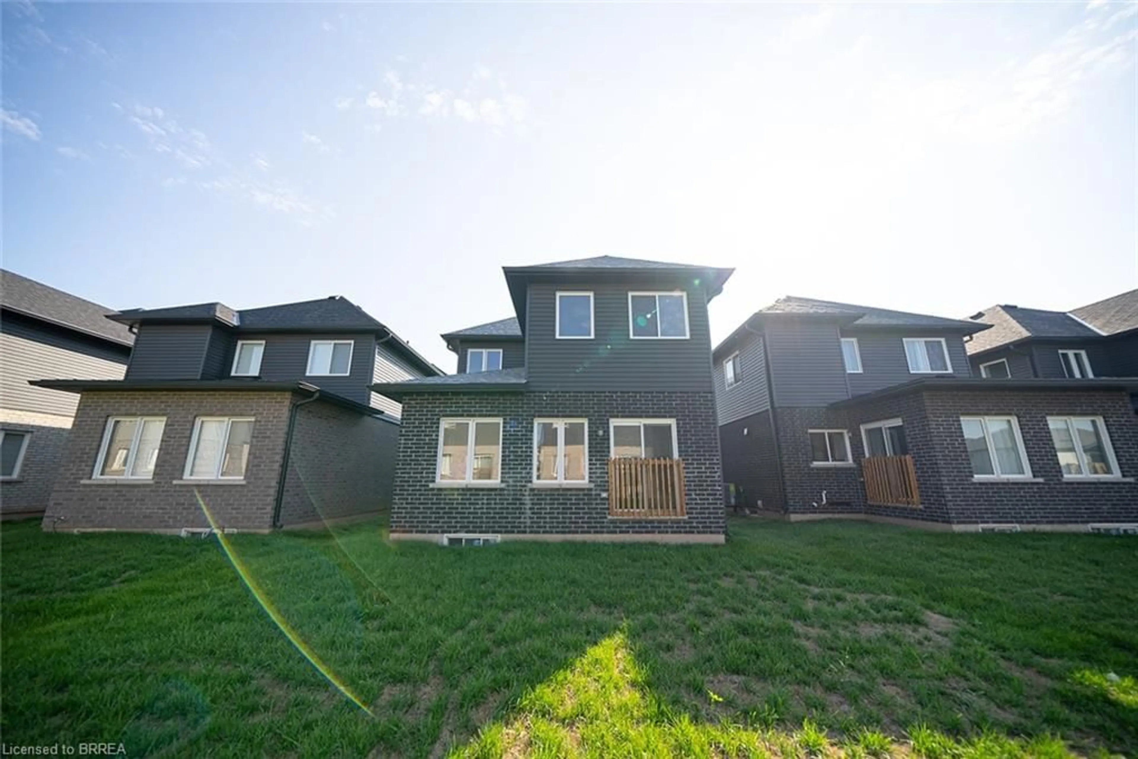 Frontside or backside of a home, the fenced backyard for 52 Bradley Ave, Welland Ontario L3B 5W2