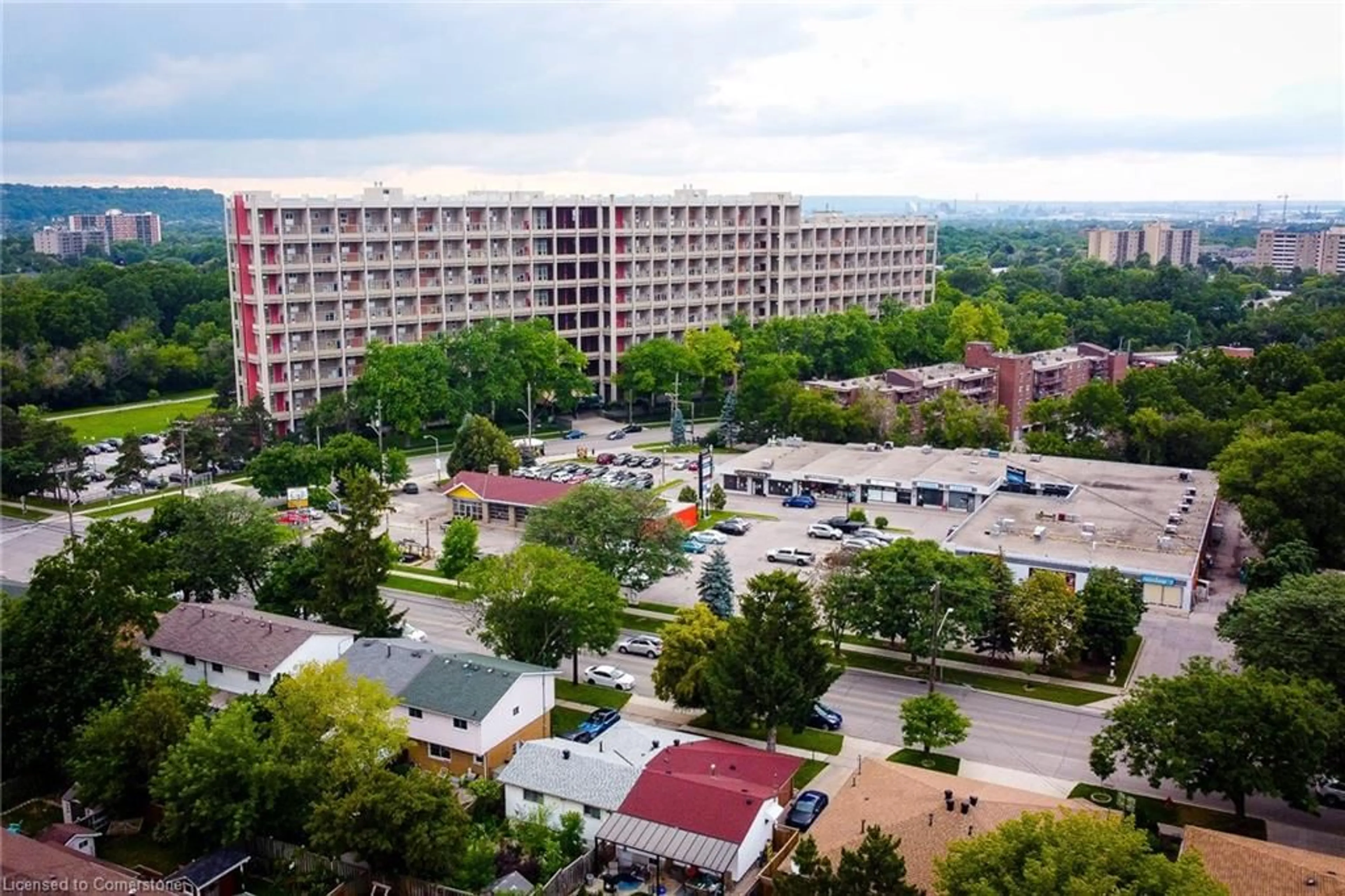 A pic from exterior of the house or condo, the view of city buildings for 350 Quigley Rd #110, Hamilton Ontario L8K 5N2