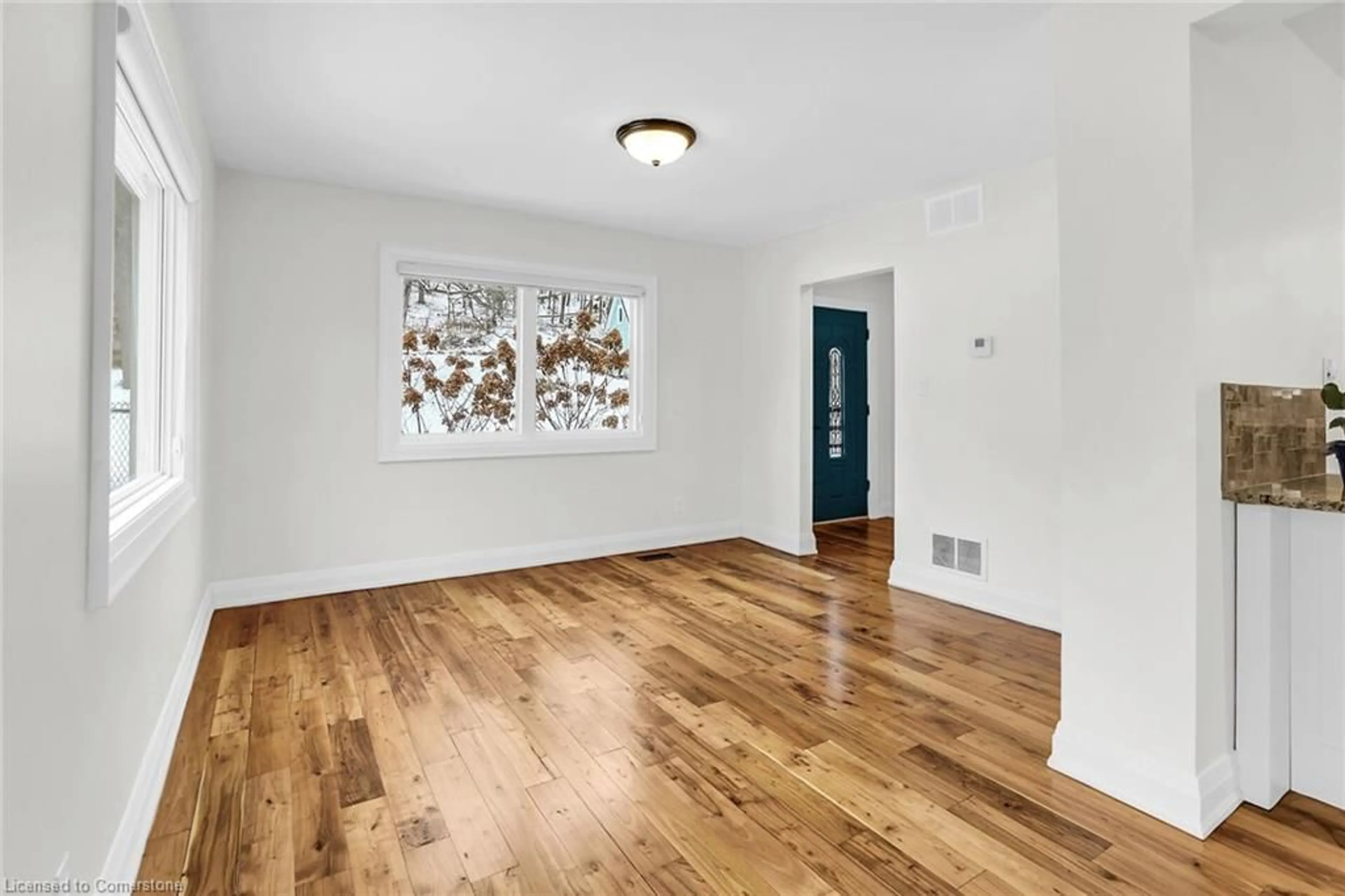 A pic of a room, wood floors for 115 Gibson St, Grimsby Ontario L3M 1G8