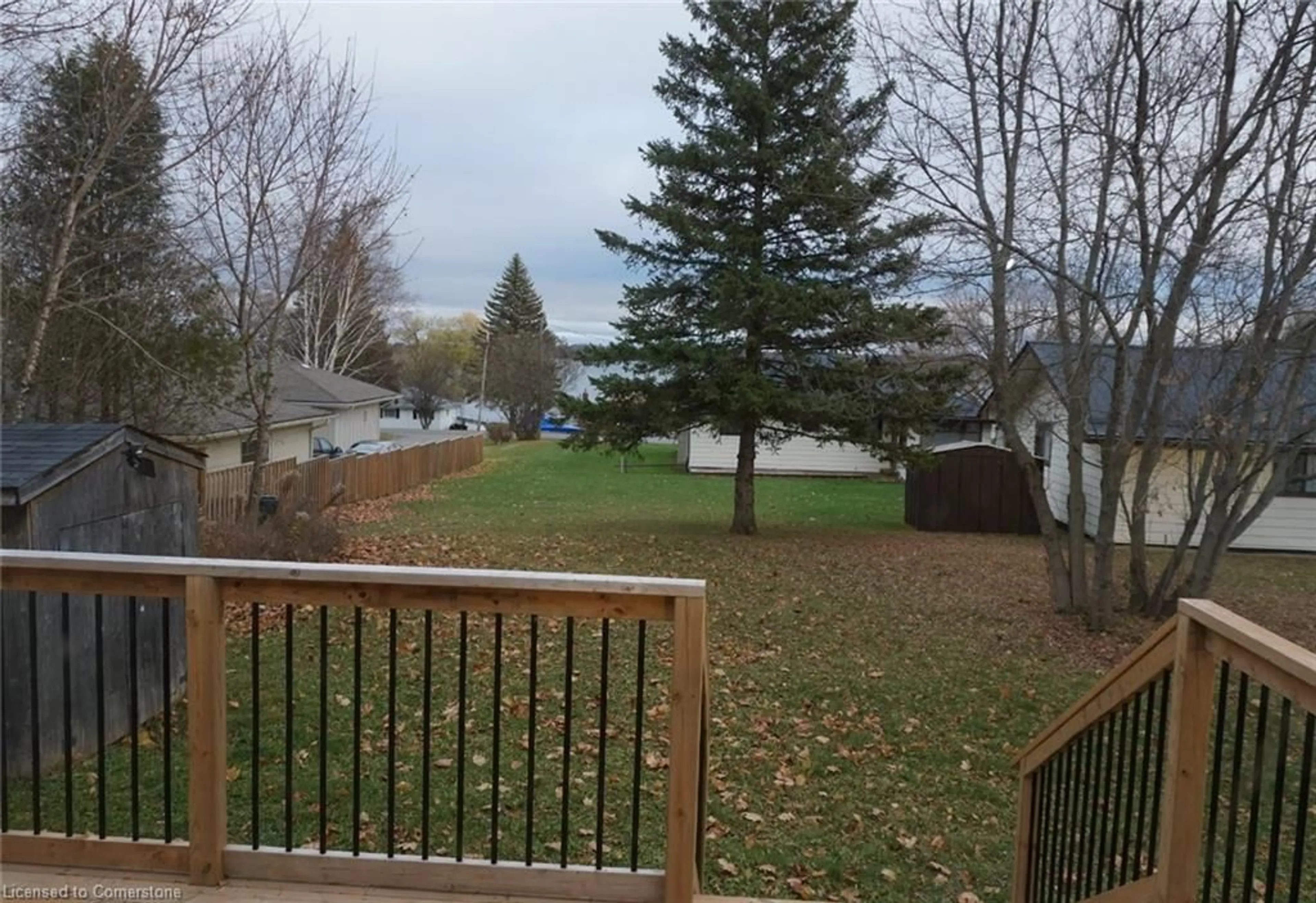 Frontside or backside of a home, the fenced backyard for 248 Crosby Dr, Bobcaygeon Ontario K0M 1A0