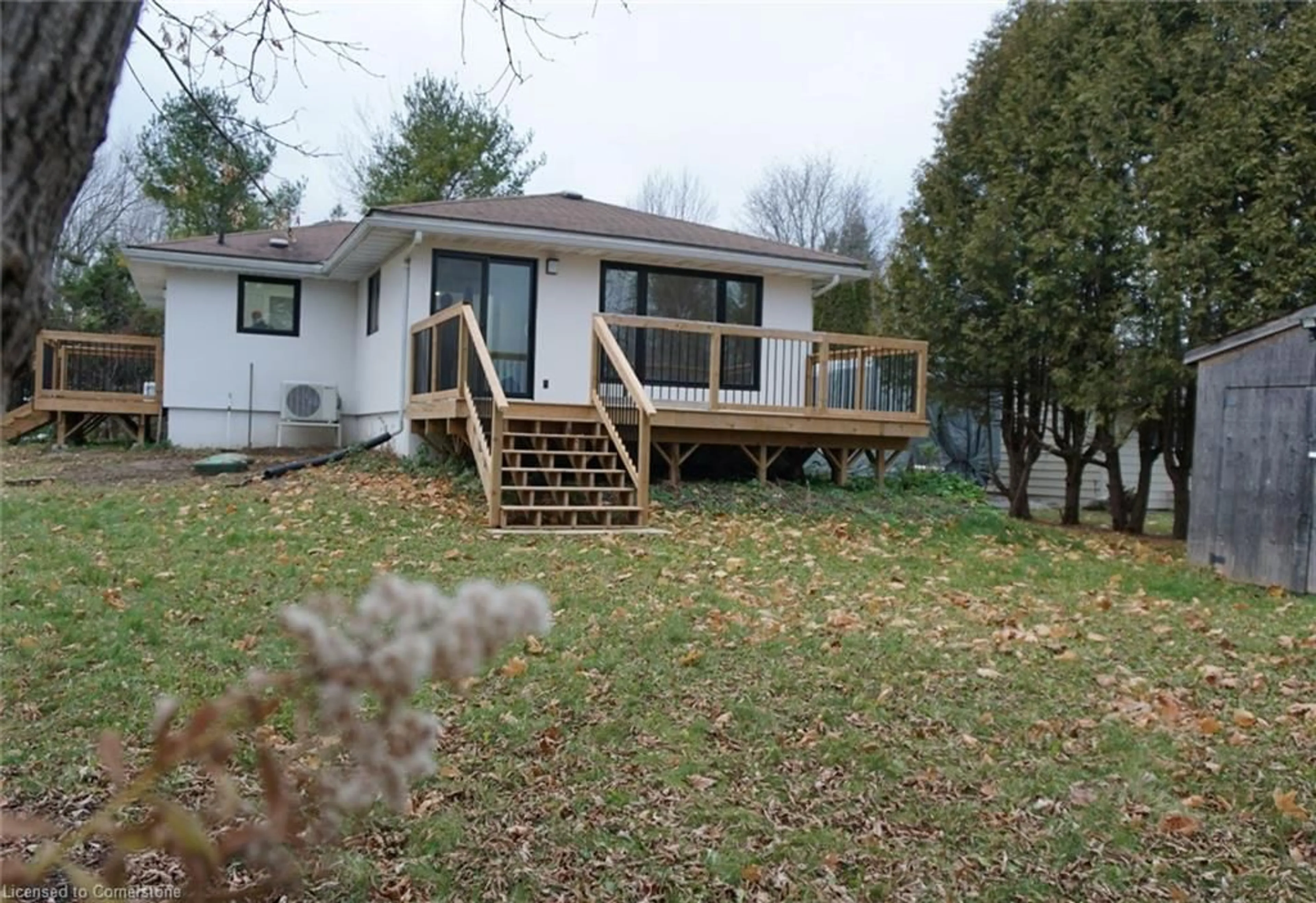 Frontside or backside of a home, the fenced backyard for 248 Crosby Dr, Bobcaygeon Ontario K0M 1A0