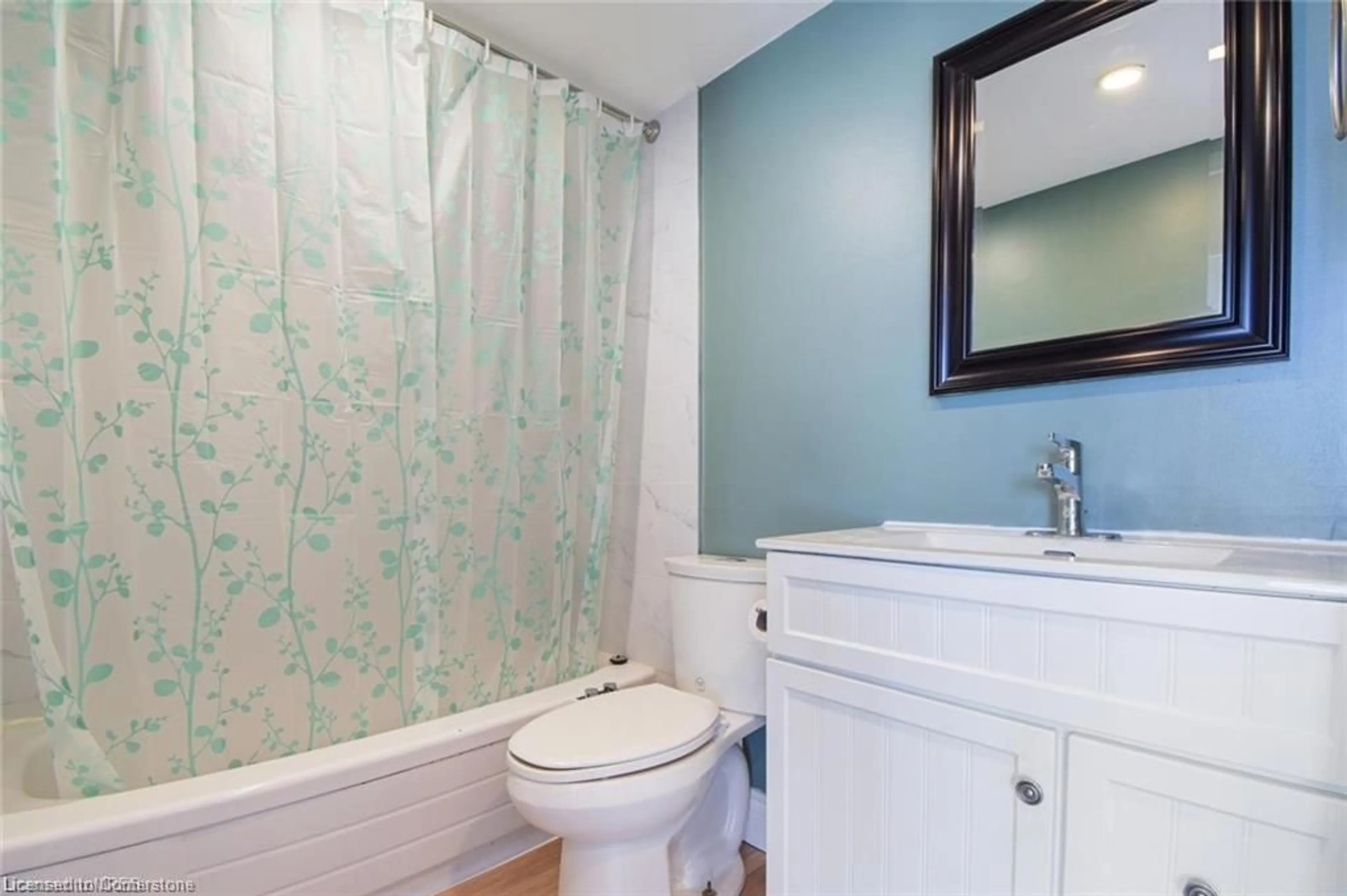 Standard bathroom, wood floors for 150 Charlton Ave #2303, Hamilton Ontario L8N 3X3