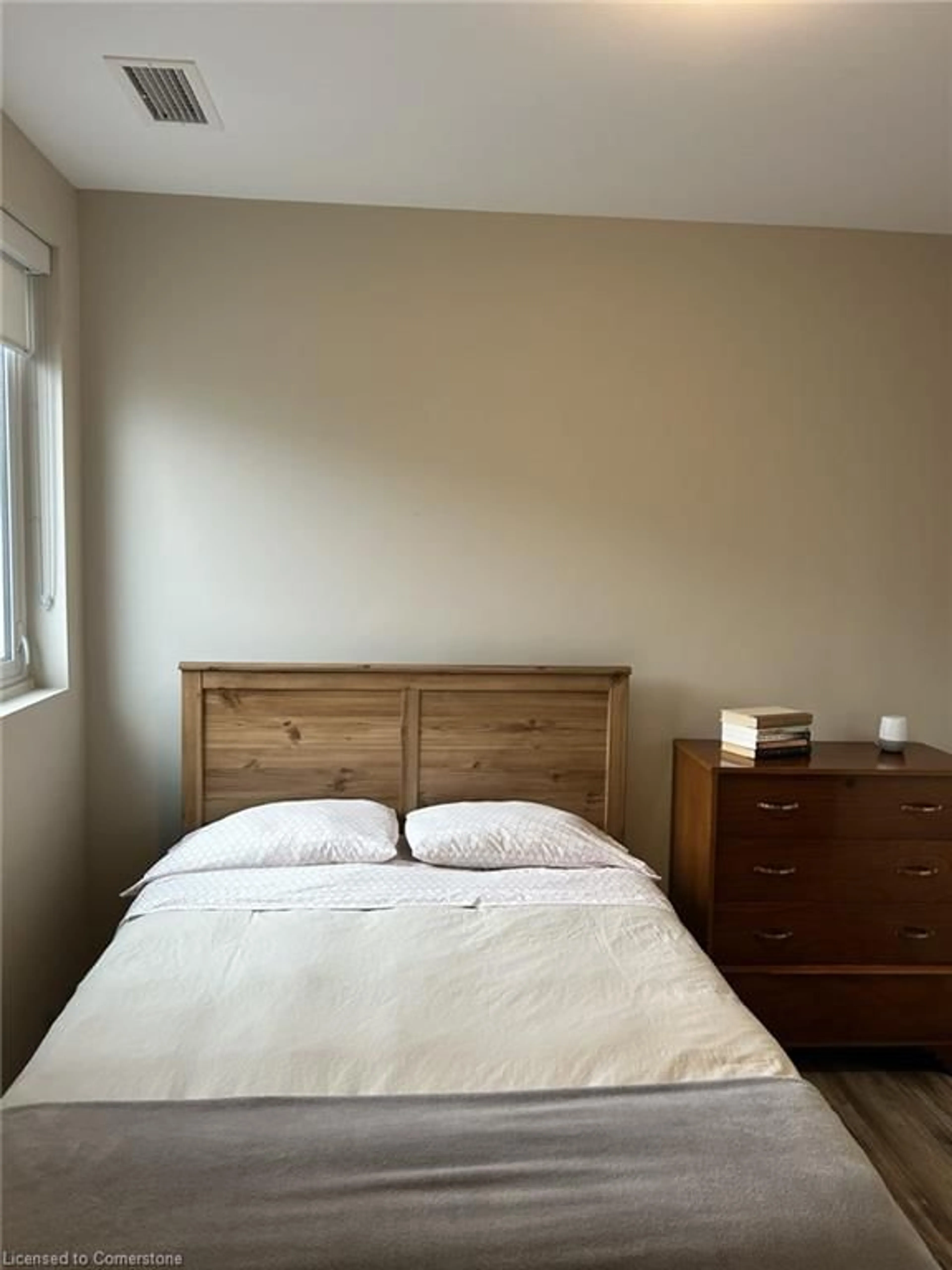 Bedroom with bed, wood/laminate floor for 104 Garment St #1702, Kitchener Ontario N2G 0C8