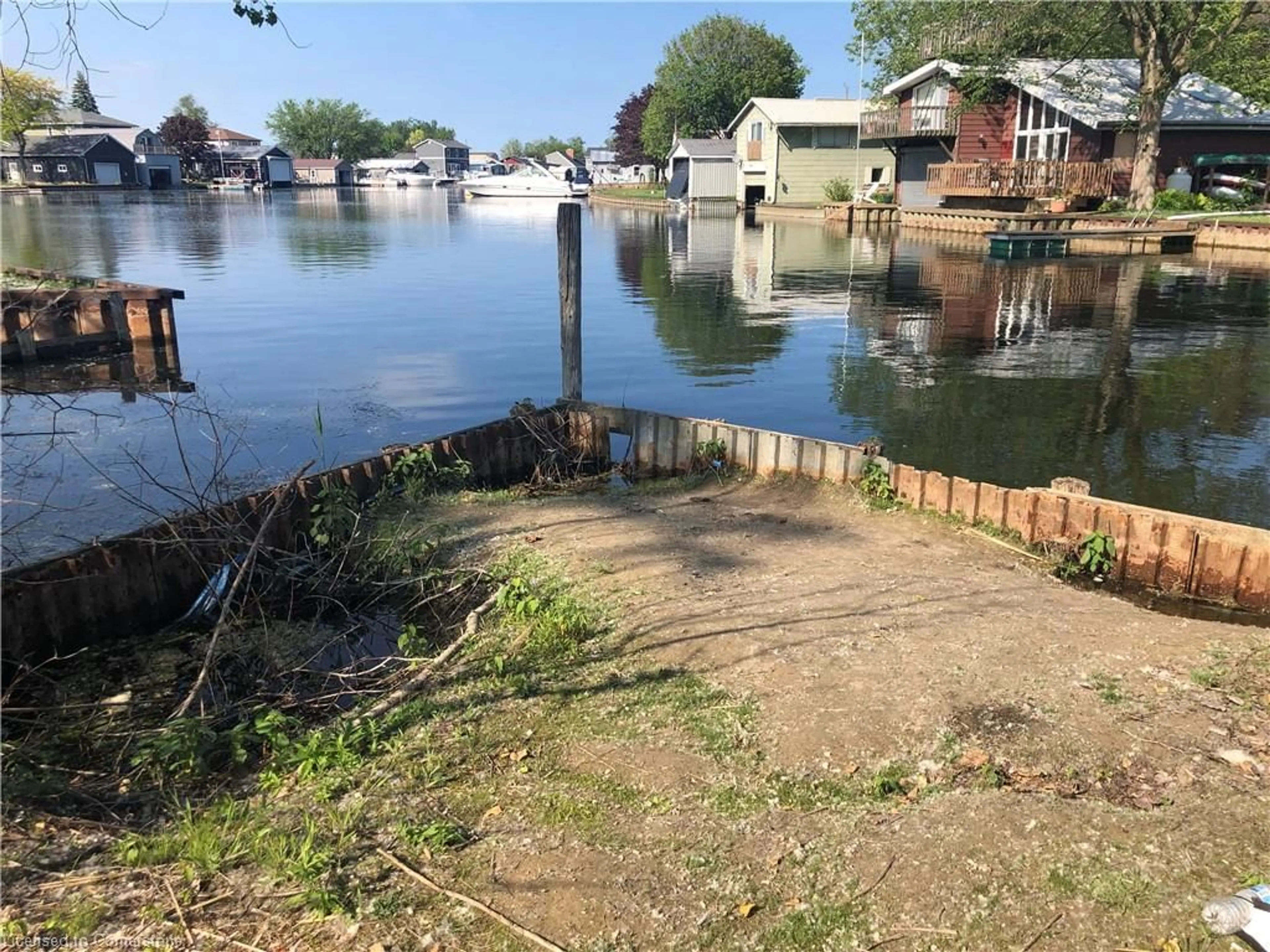 A pic from outside/outdoor area/front of a property/back of a property/a pic from drone, water/lake/river/ocean view for 23 Old Cut Blvd, Long Point Ontario N0E 1M0