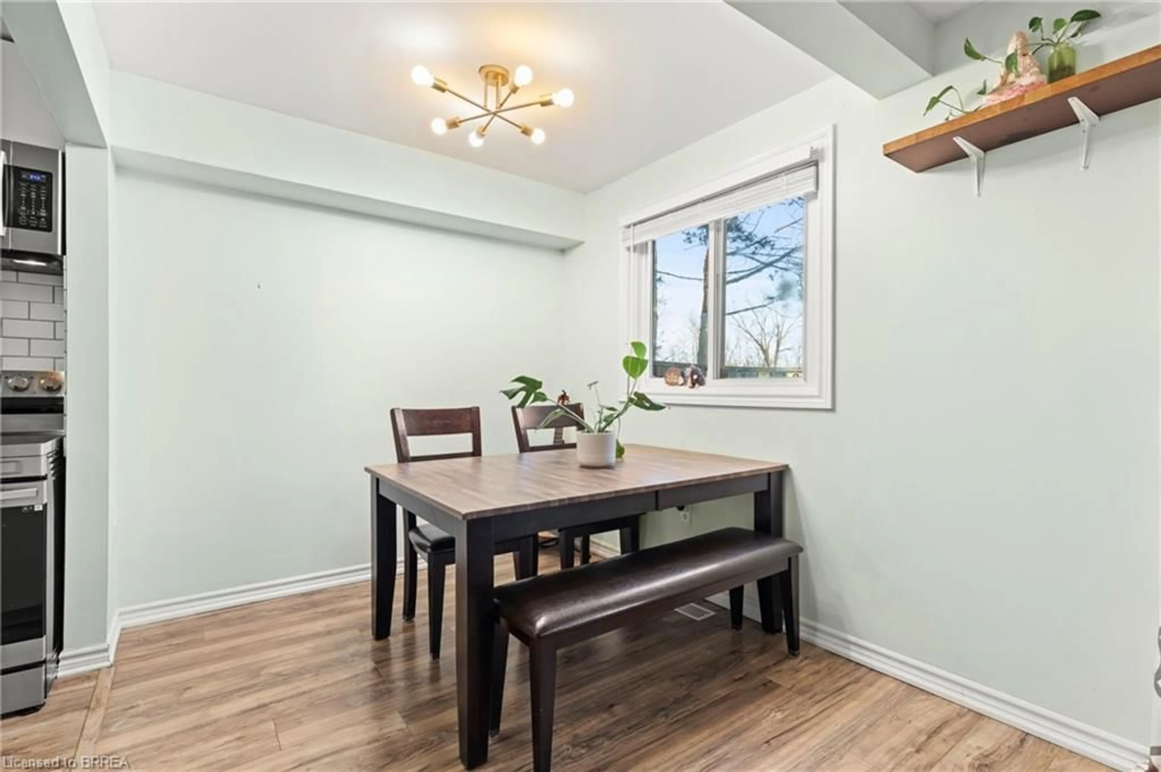 Dining room, wood/laminate floor for 100 Quigley Rd #126, Hamilton Ontario L8K 6J1