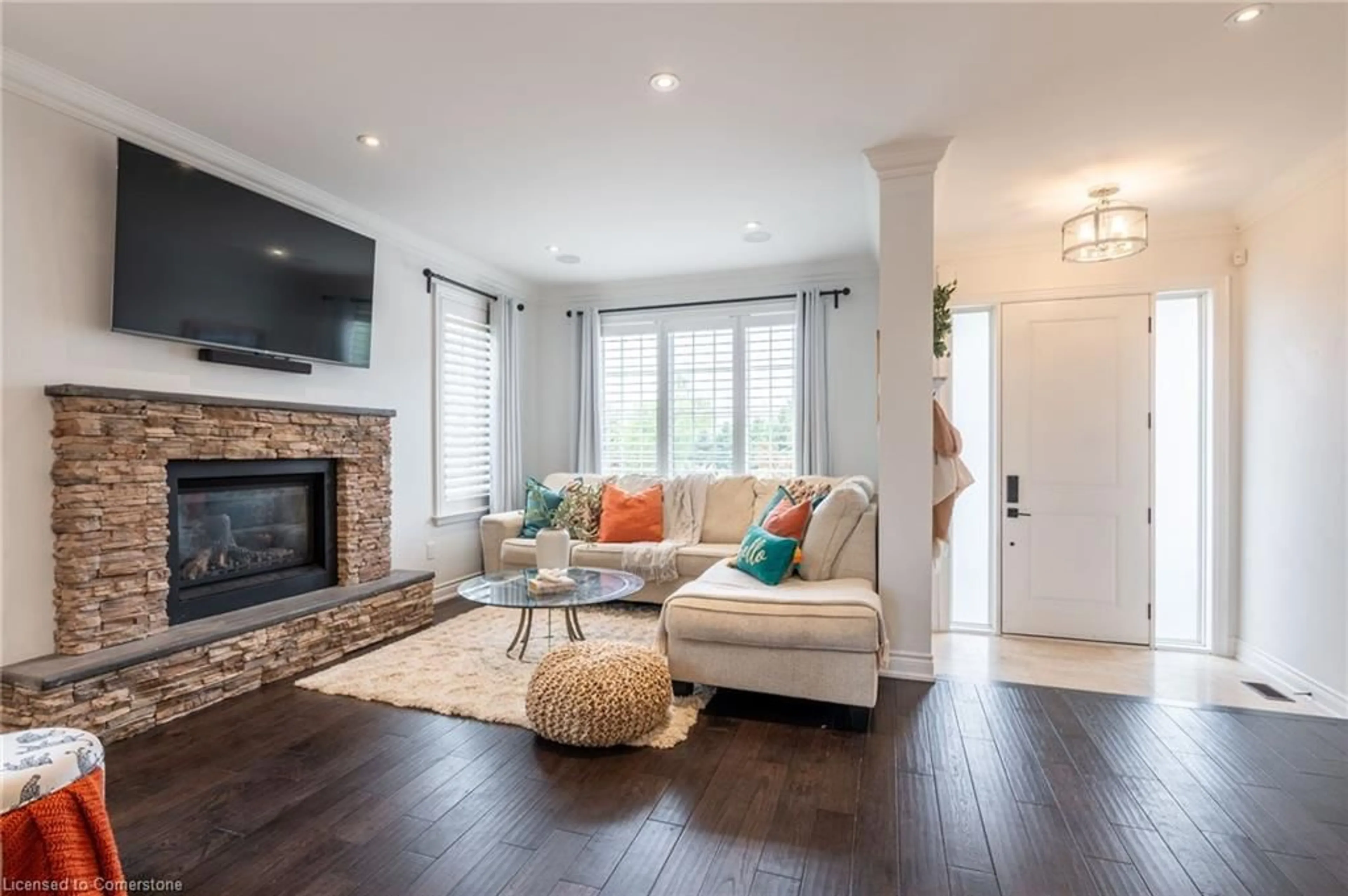 Living room with furniture, wood/laminate floor for 4610 Cornerstone Dr, Burlington Ontario L7M 0C9