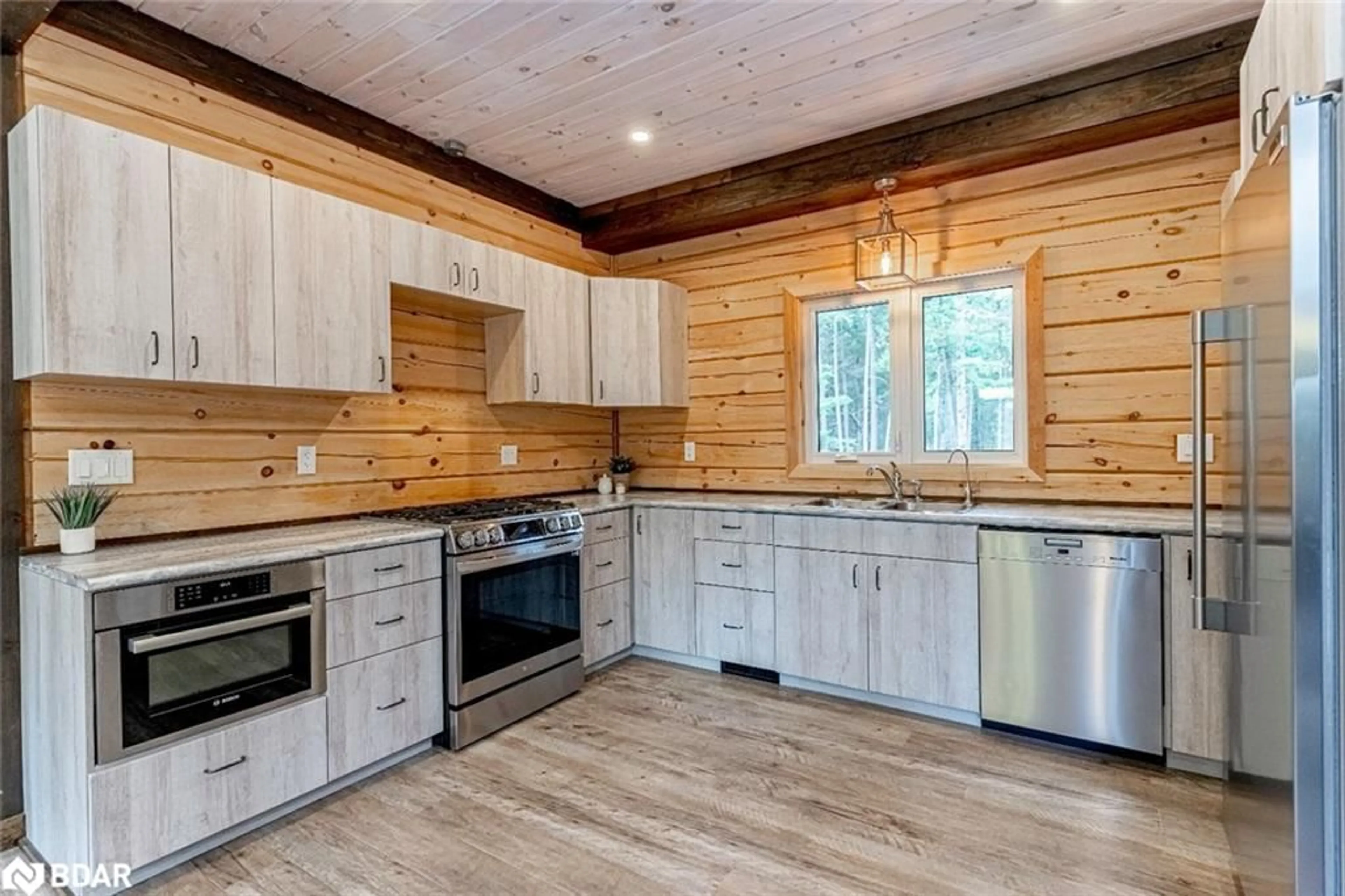 Rustic kitchen, wood/laminate floor for 4057 Cambrian Road, Washago Ontario L0K 2B0