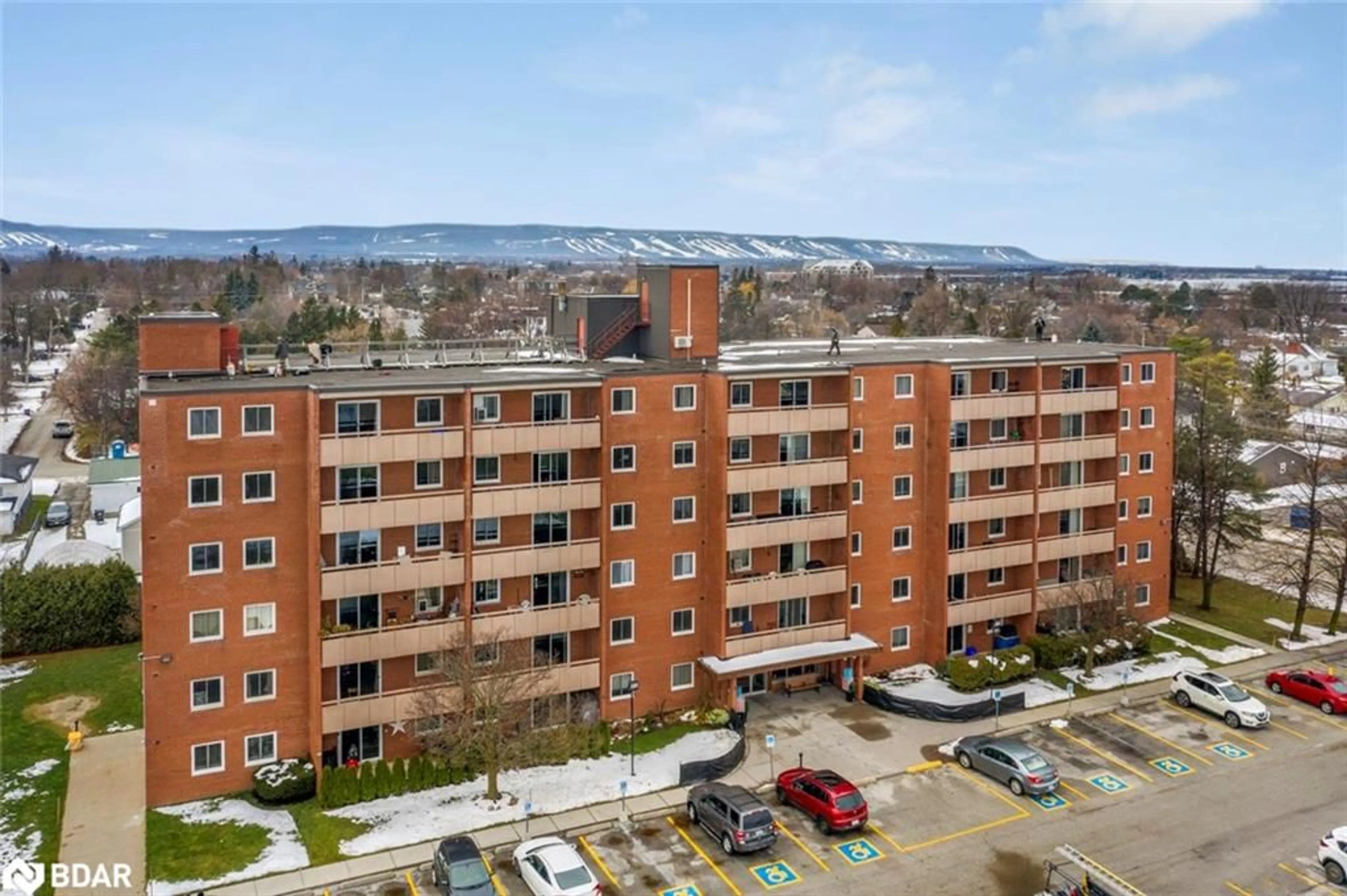 A pic from outside/outdoor area/front of a property/back of a property/a pic from drone, city buildings view from balcony for 460 Ontario St #407, Collingwood Ontario L9Y 4E5