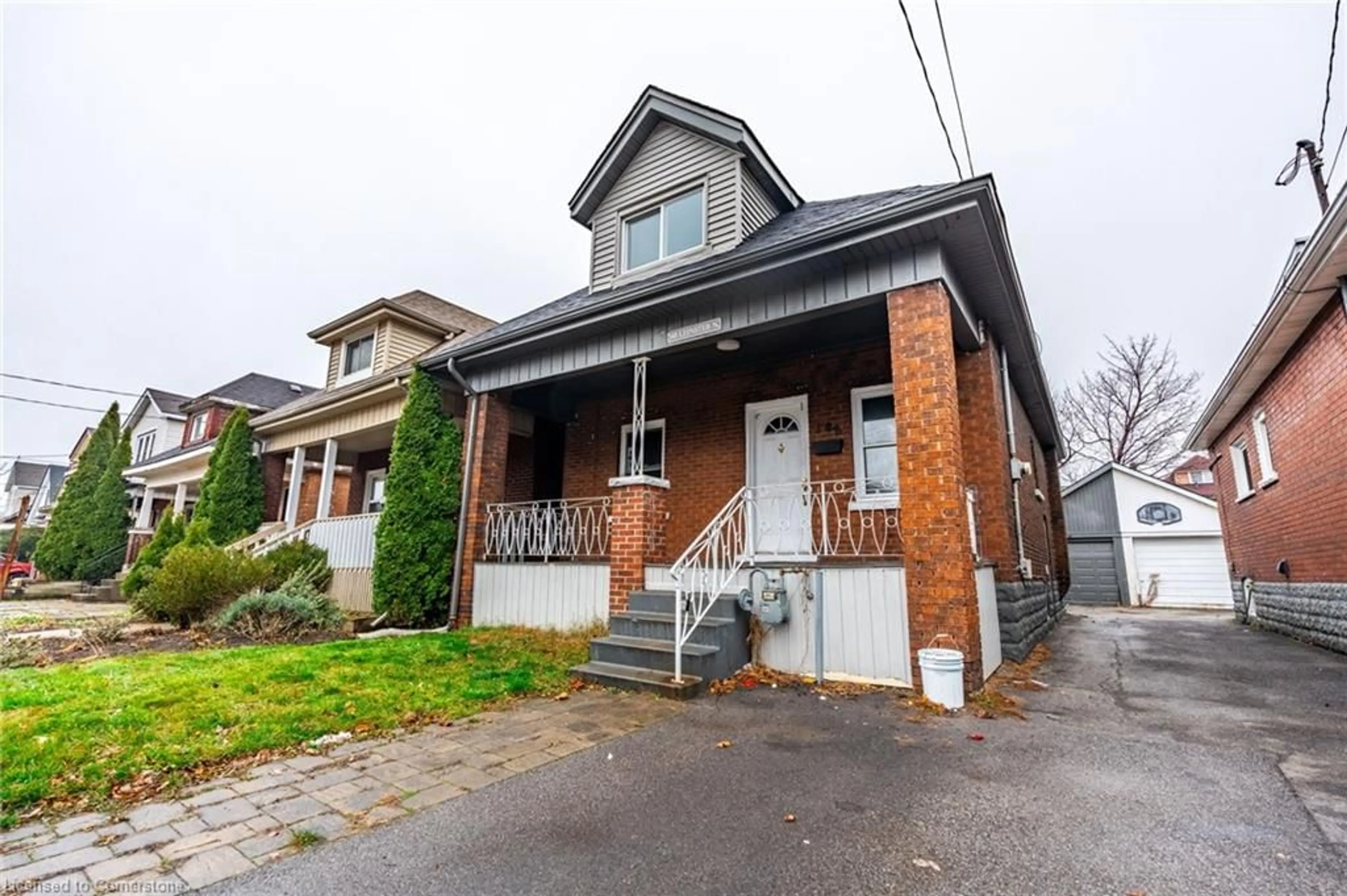 Home with brick exterior material, street for 148 Leinster Ave, Hamilton Ontario L8L 6X9