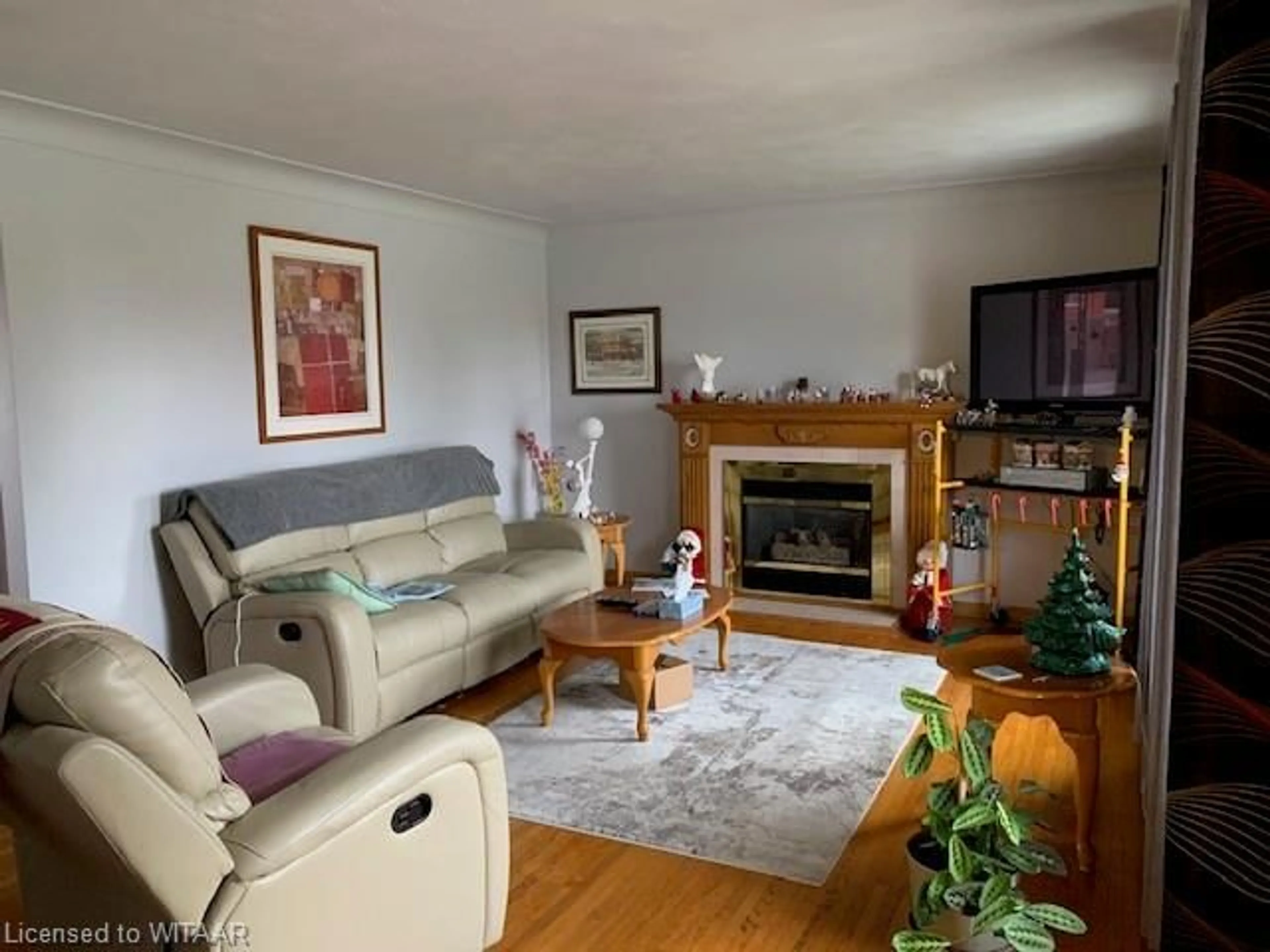 Living room with furniture, wood/laminate floor for 170 Highway #3, Courtland Ontario N0J 1E0