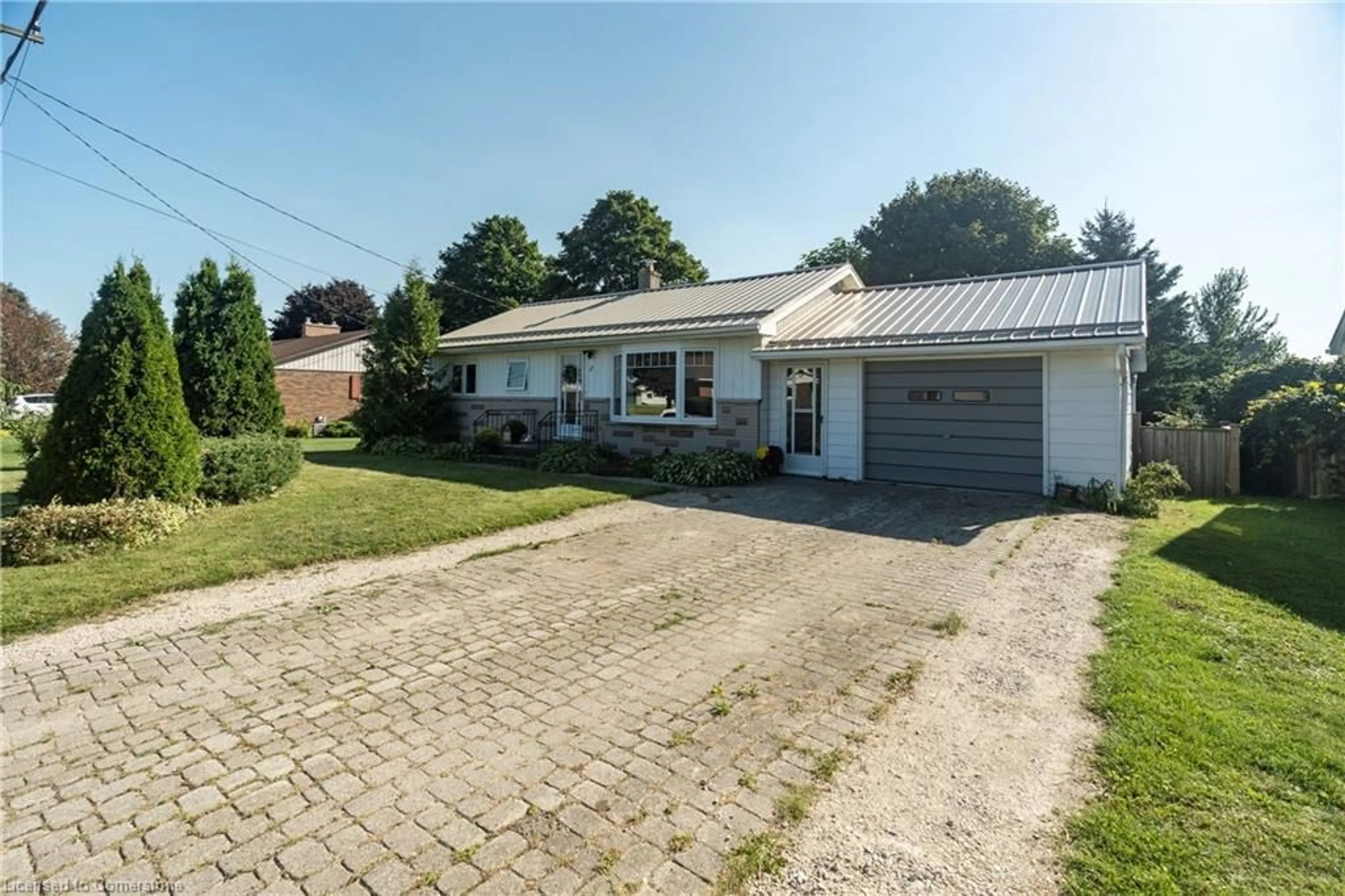 A pic from outside/outdoor area/front of a property/back of a property/a pic from drone, street for 44 Herbert Ave, Markdale Ontario N0C 1H0