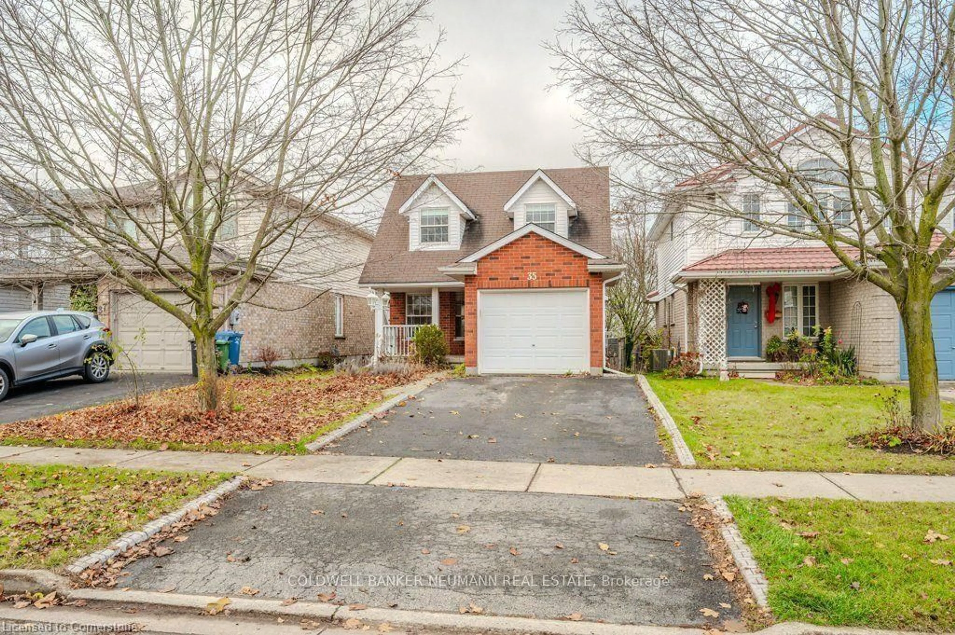 Home with brick exterior material, street for 35 Waxwing Cres, Guelph Ontario N1C 1E3