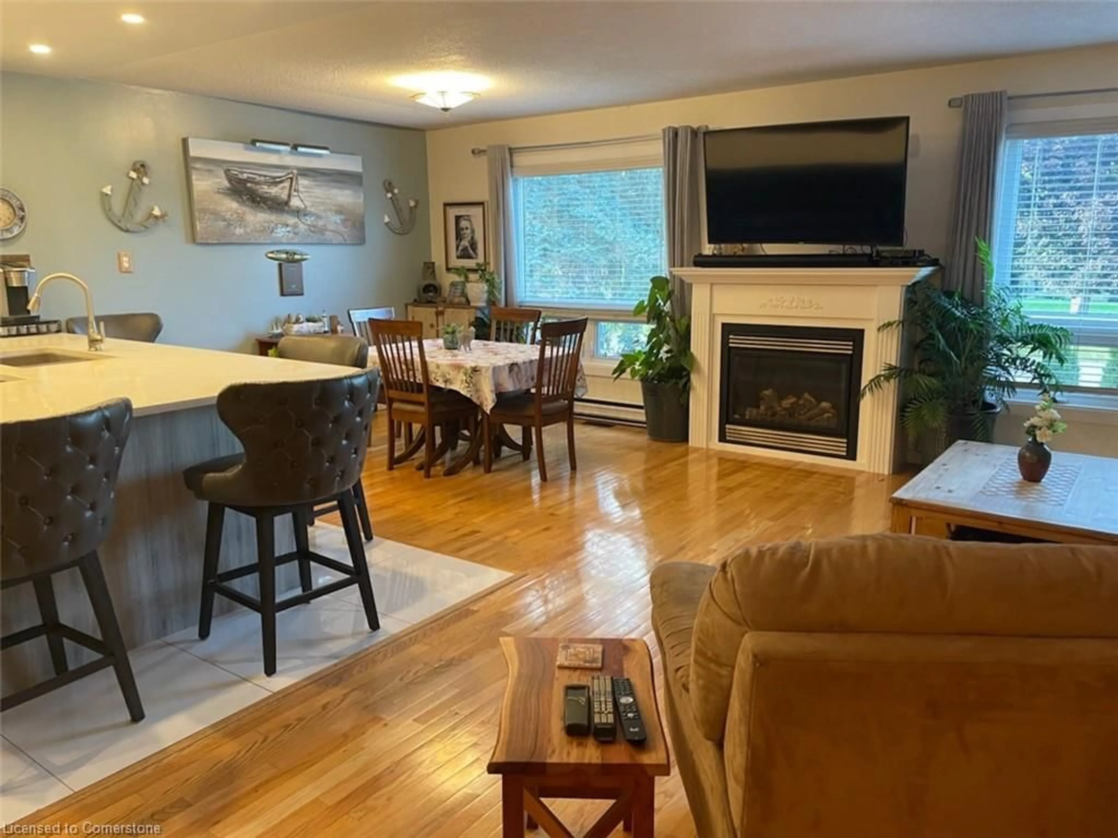 Living room with furniture, wood/laminate floor for 439 Mooney Cres, Orillia Ontario L3V 6R5