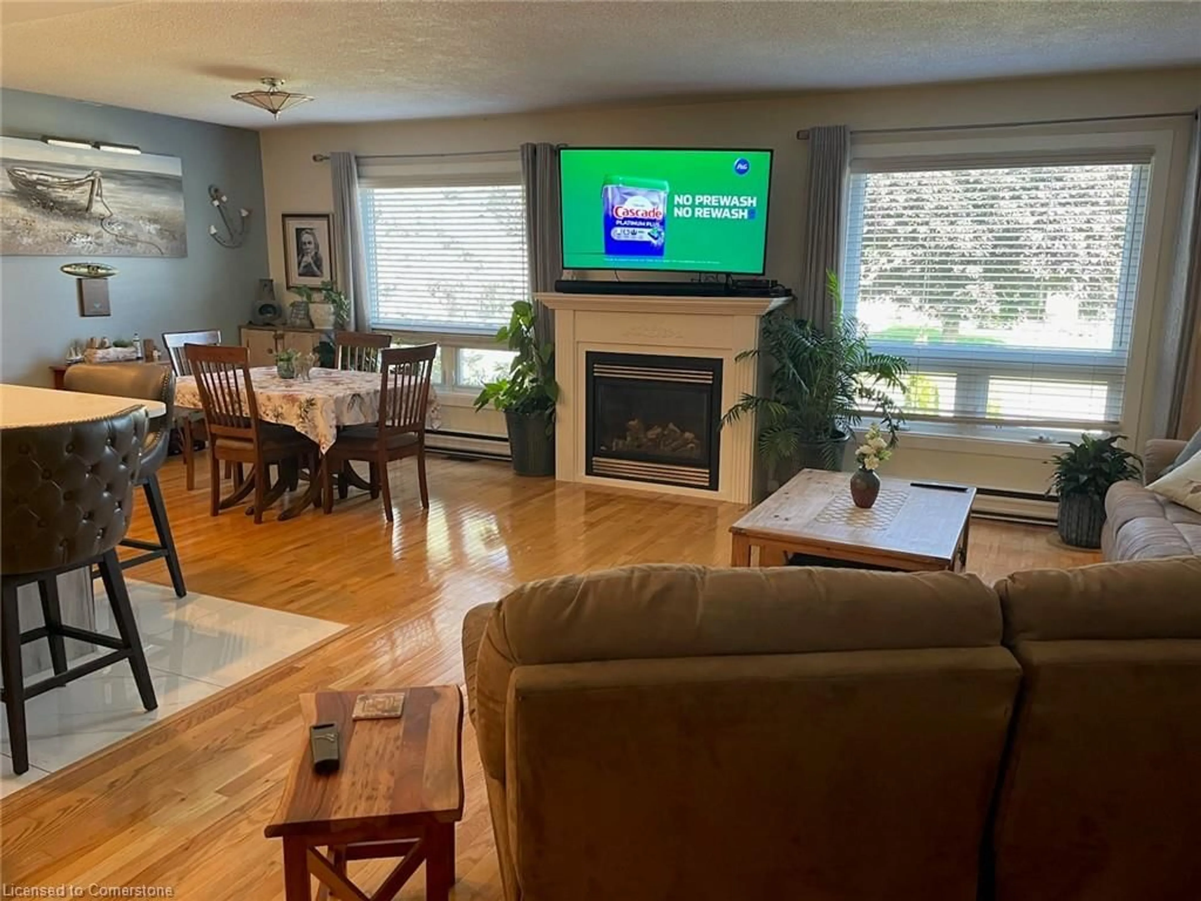 Living room with furniture, wood/laminate floor for 439 Mooney Cres, Orillia Ontario L3V 6R5