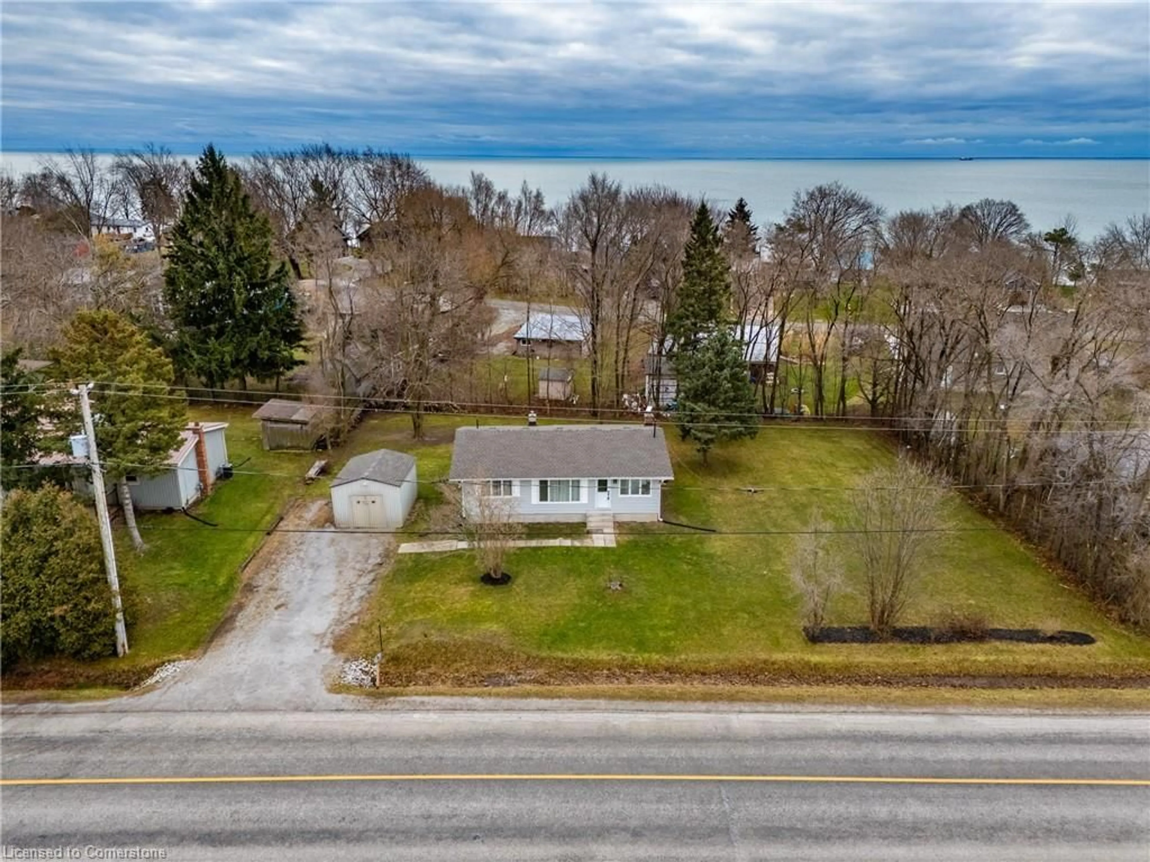 A pic from outside/outdoor area/front of a property/back of a property/a pic from drone, street for 594 New Lakeshore Rd, Port Dover Ontario N0A 1N3