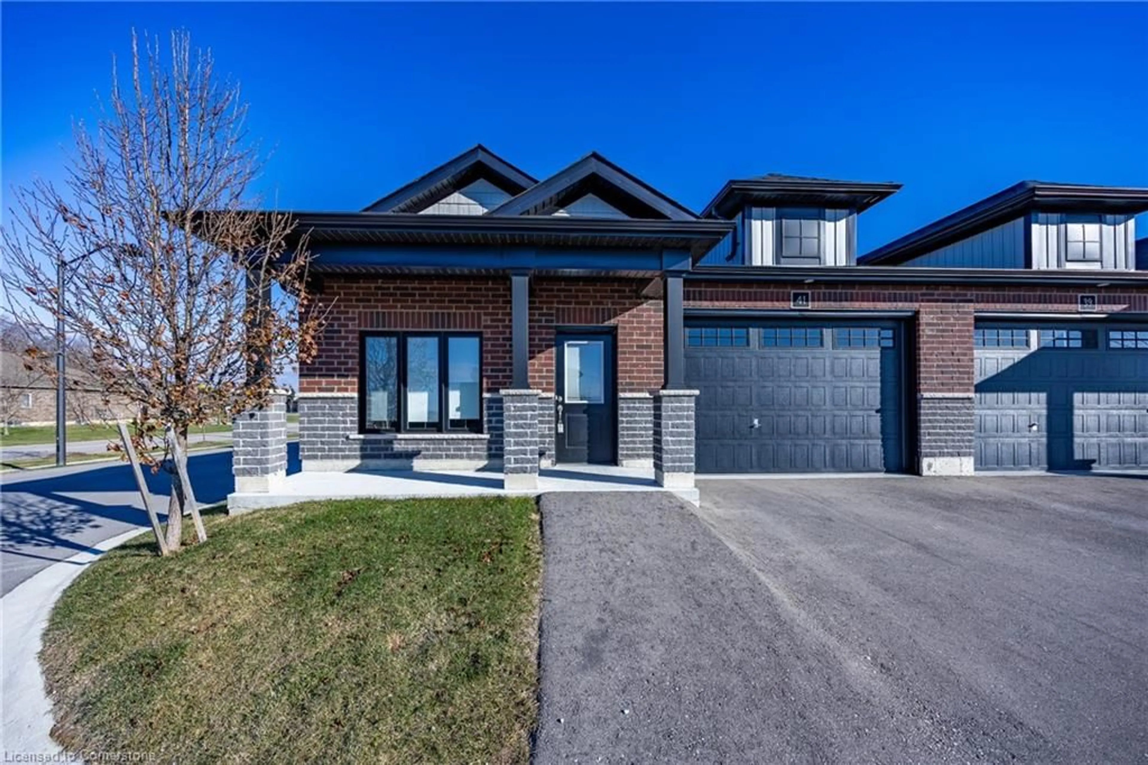 Home with brick exterior material, street for 41 Waterthrush Lane, Simcoe Ontario N3Y 0E9