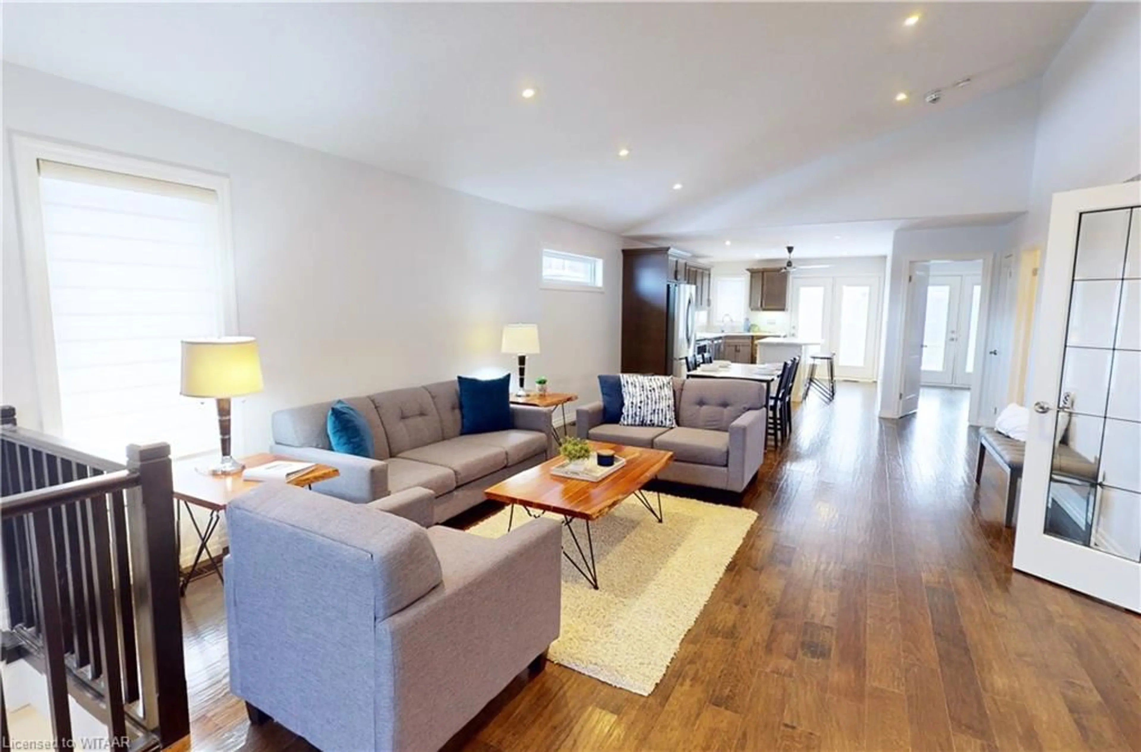 Living room with furniture, wood/laminate floor for 491 Fairway Rd, Woodstock Ontario N4T 0E7
