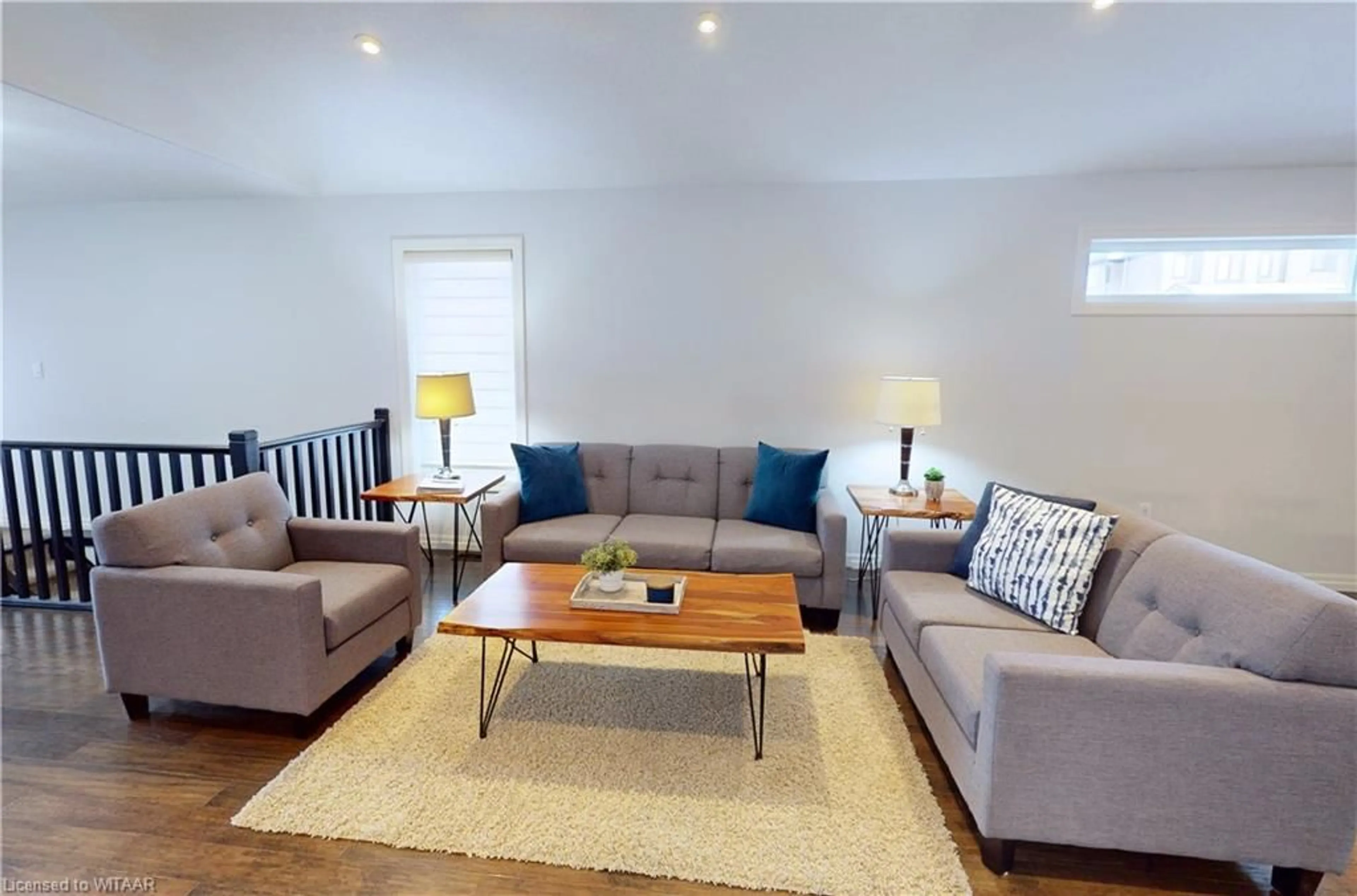 Living room with furniture, wood/laminate floor for 491 Fairway Rd, Woodstock Ontario N4T 0E7