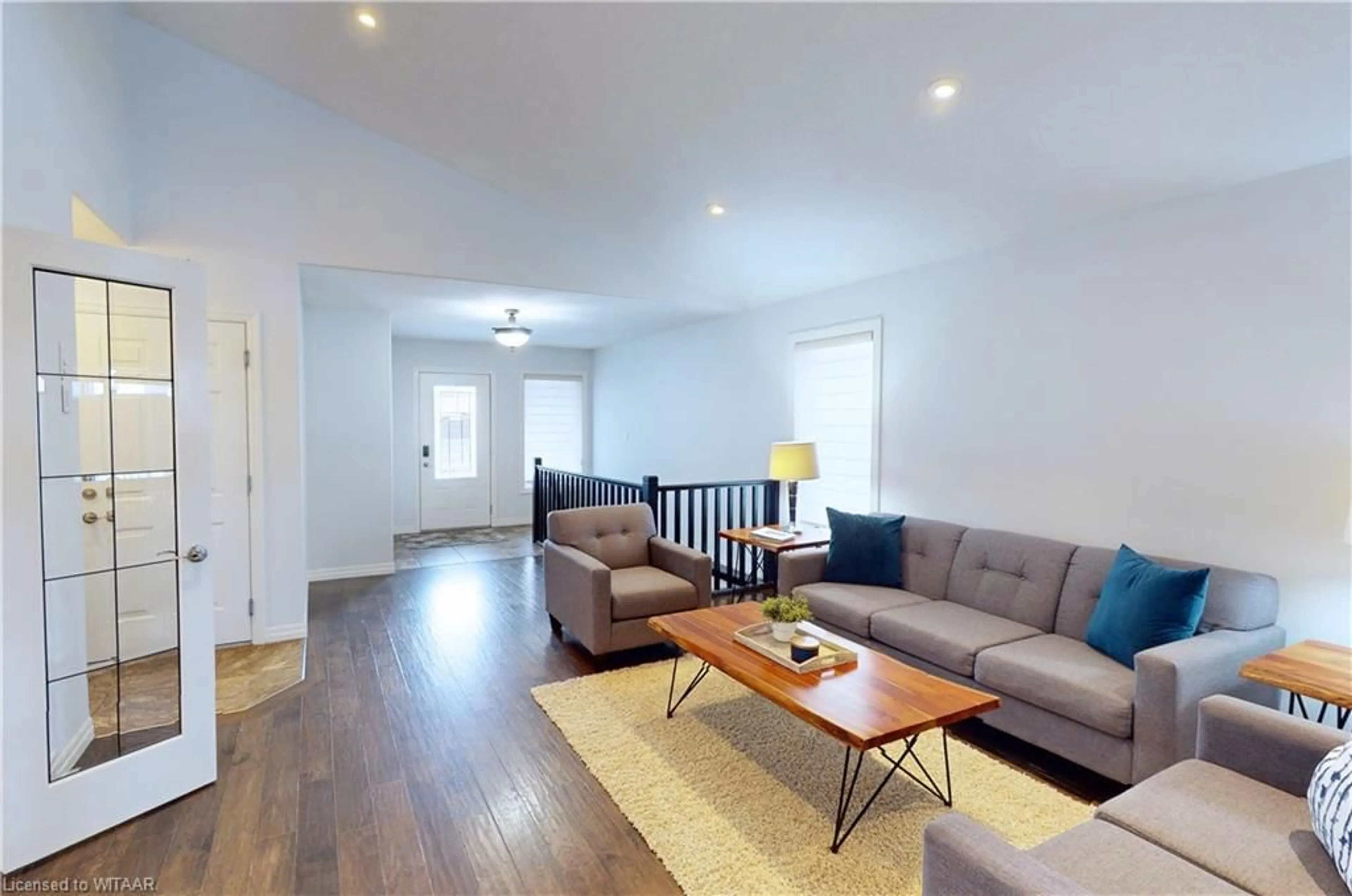 Living room with furniture, wood/laminate floor for 491 Fairway Rd, Woodstock Ontario N4T 0E7