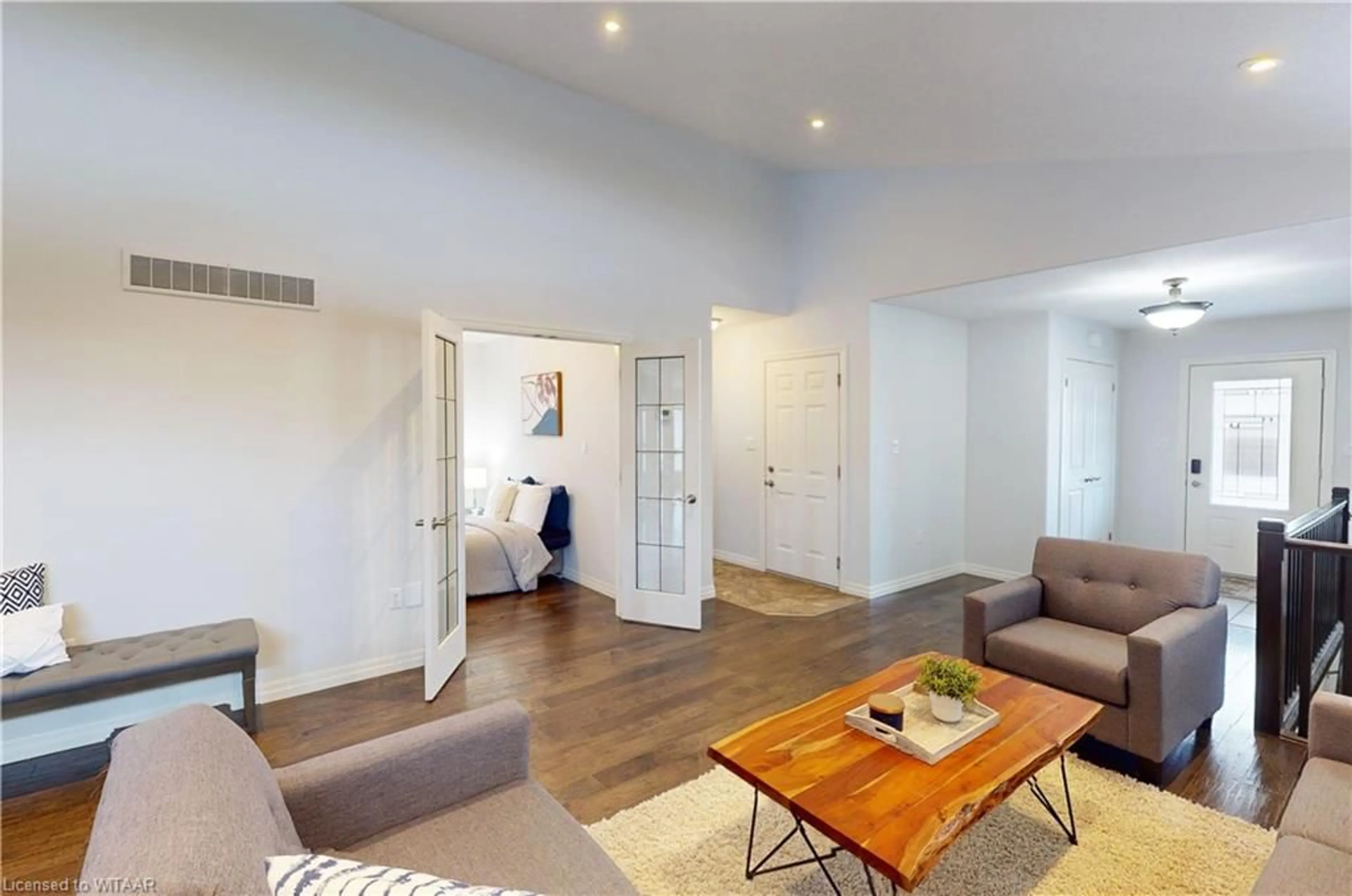 Living room with furniture, wood/laminate floor for 491 Fairway Rd, Woodstock Ontario N4T 0E7