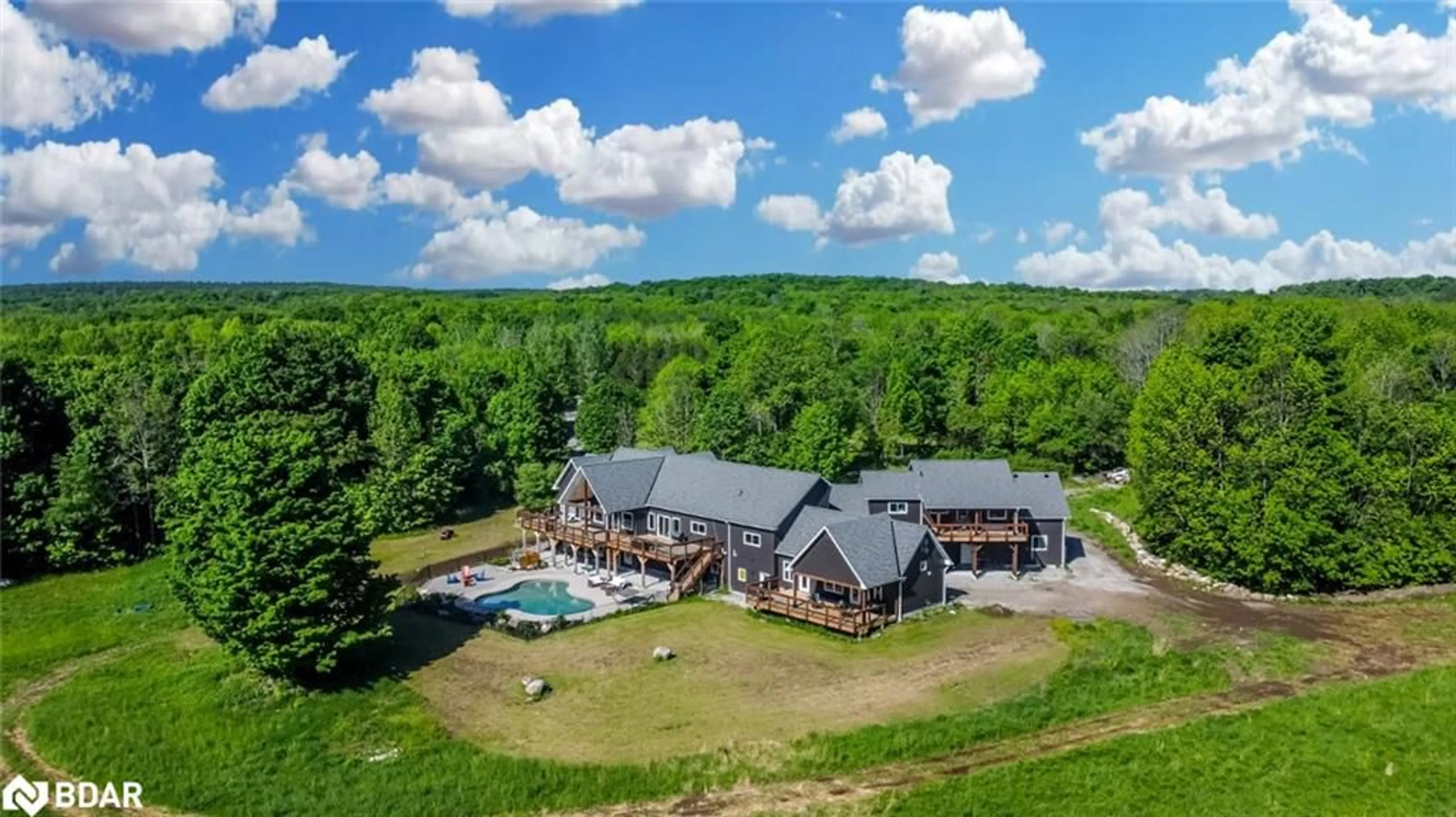 A pic from outside/outdoor area/front of a property/back of a property/a pic from drone, mountain view for 5385 Line 8 North, Moonstone Ontario L0K 1N0