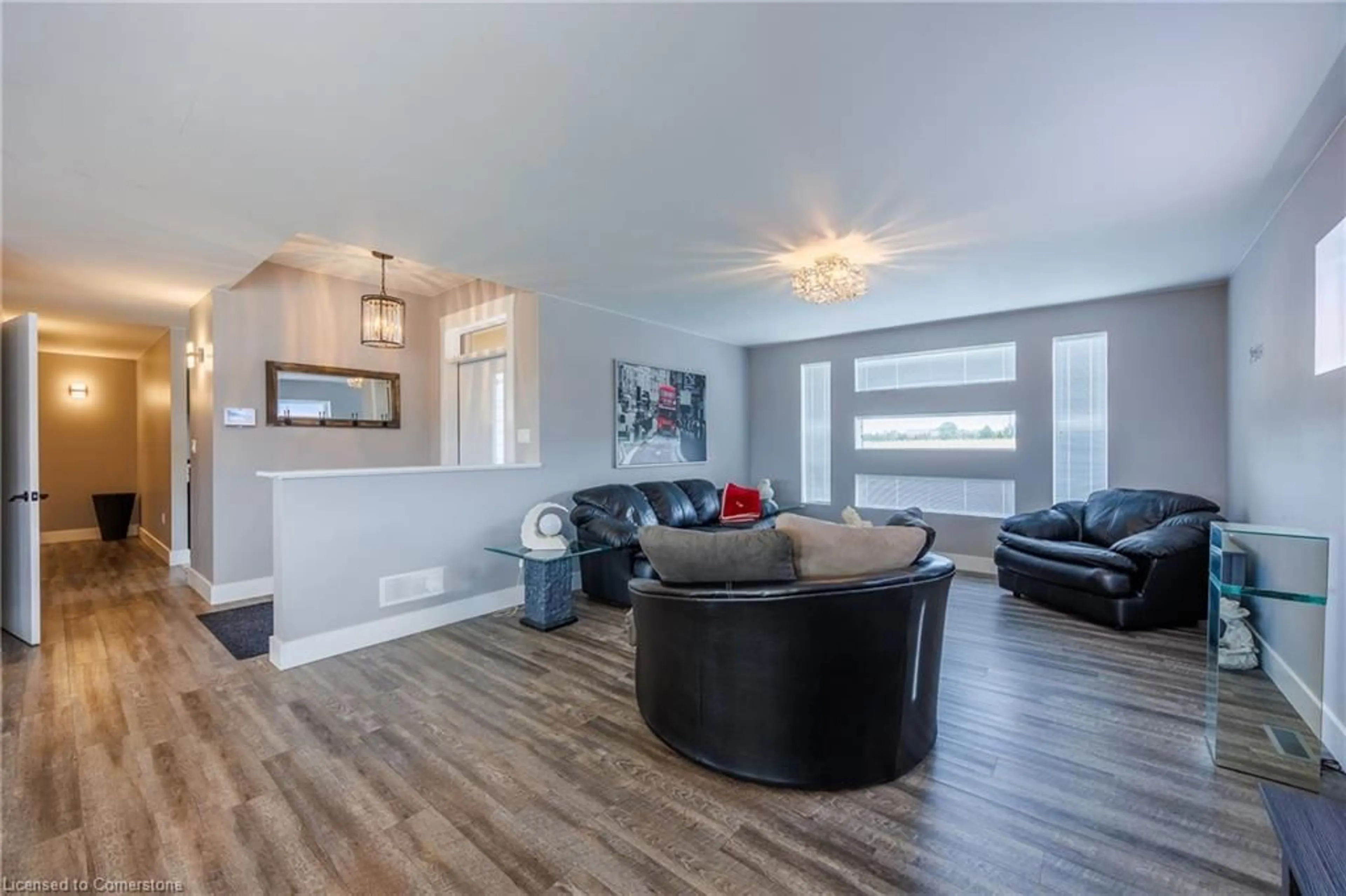 Living room with furniture, wood/laminate floor for 8383 Sandytown Road, Straffordville Ontario N0J 1Y0