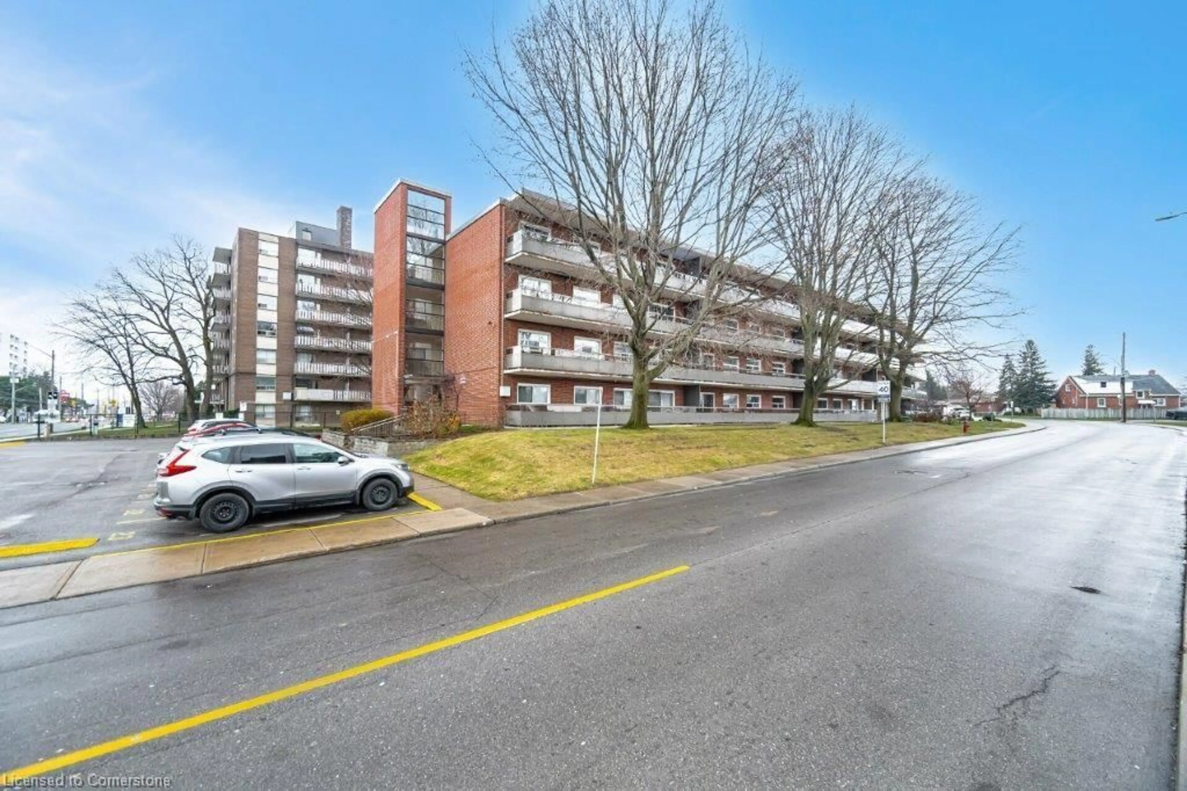 A pic from outside/outdoor area/front of a property/back of a property/a pic from drone, street for 11 Woodman Dr #203, Hamilton Ontario L8K 4E3