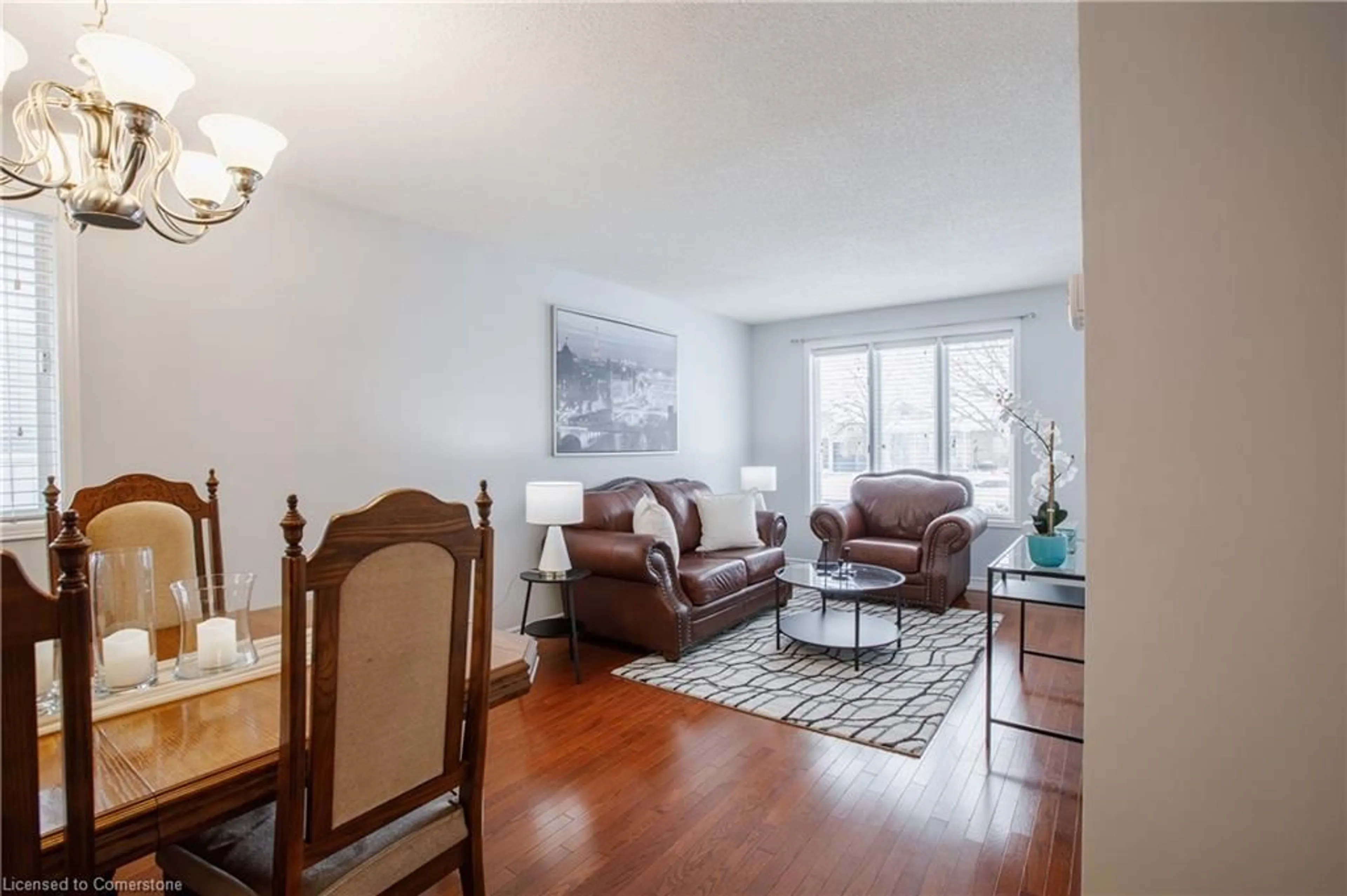 Living room with furniture, wood/laminate floor for 52 Oprington Dr, Kitchener Ontario N2N 3E1