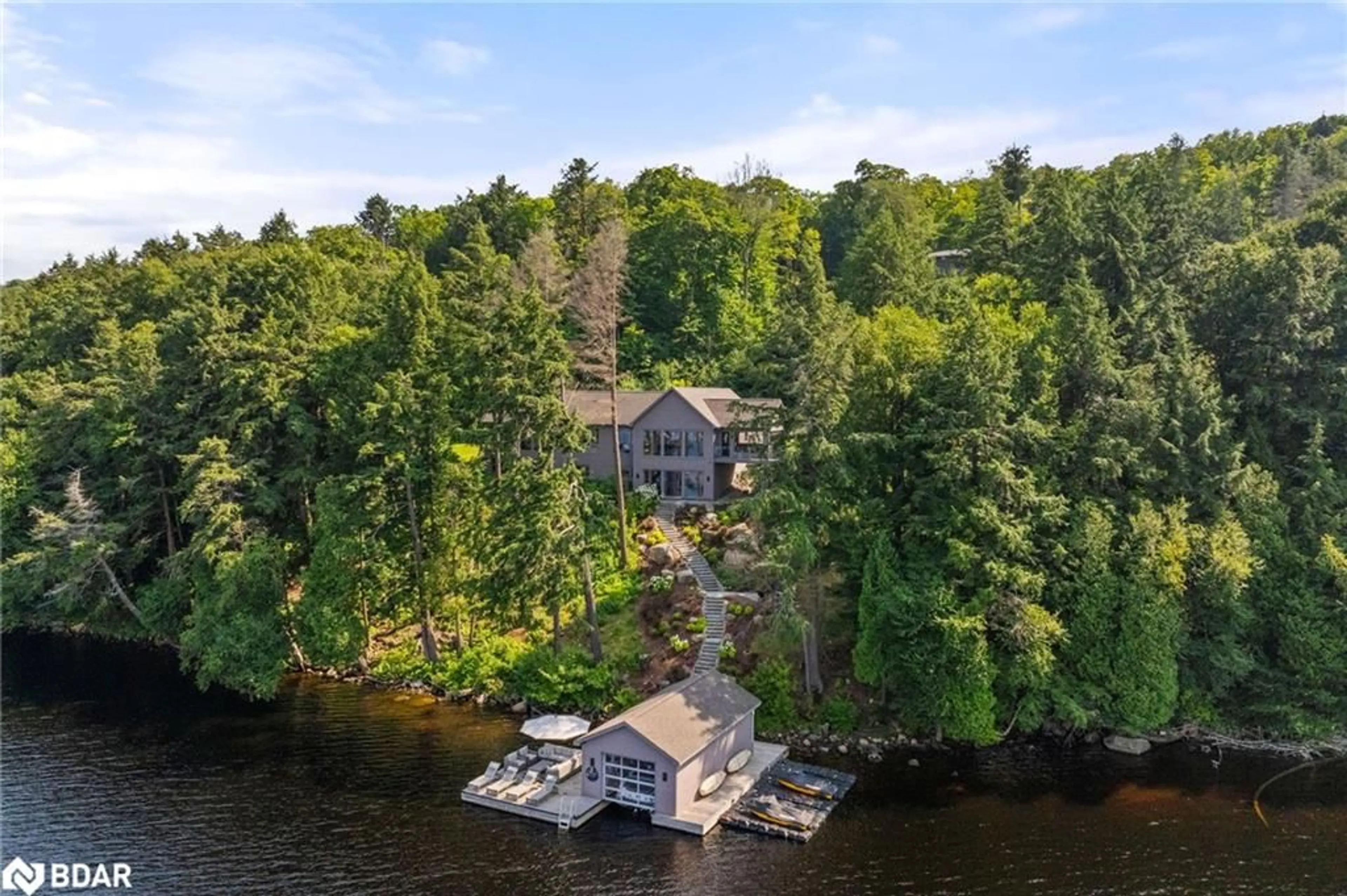 A pic from outside/outdoor area/front of a property/back of a property/a pic from drone, water/lake/river/ocean view for 124 Claren Crescent Cres, Huntsville Ontario P1H 0C3