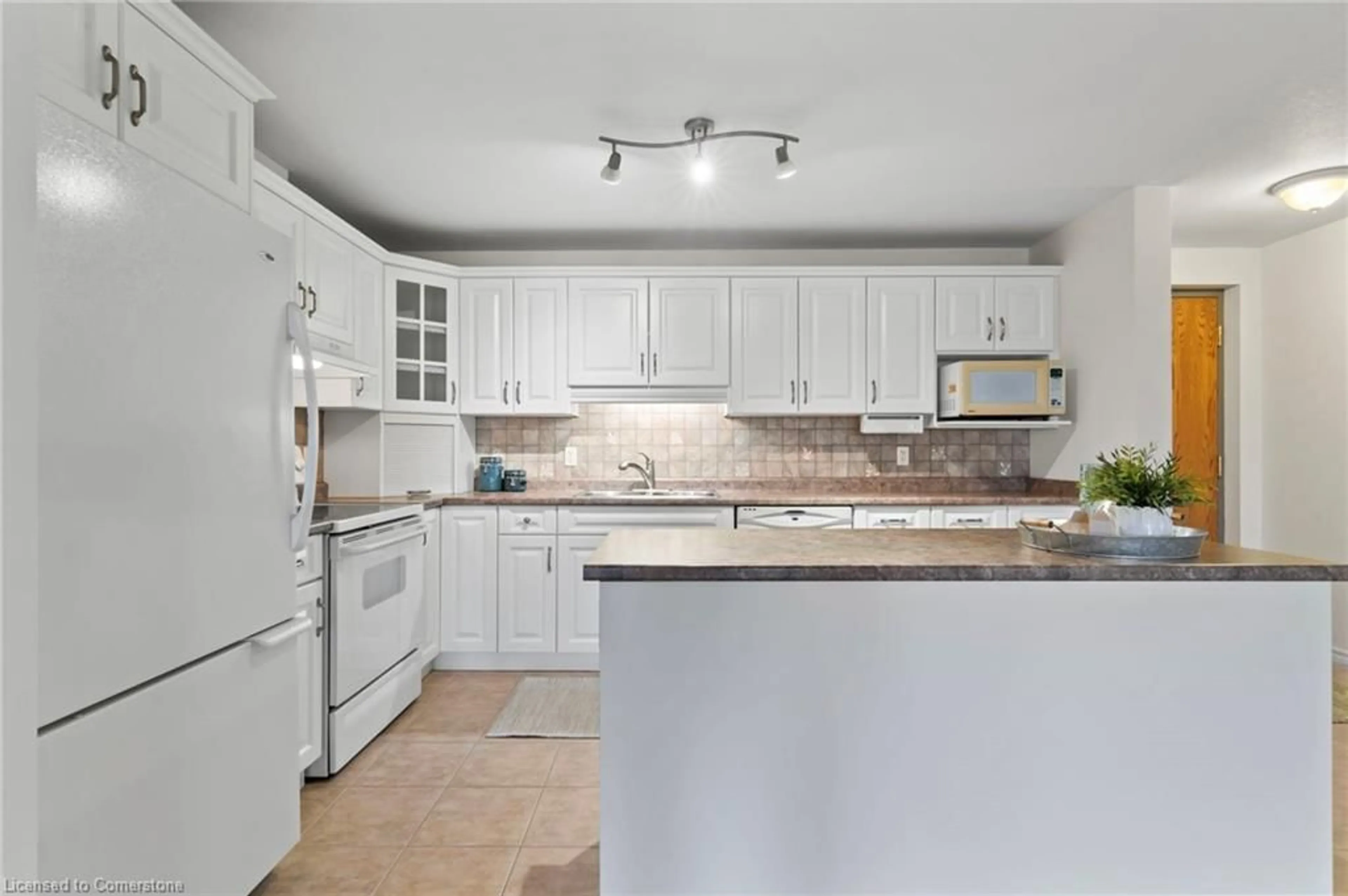 Standard kitchen, ceramic/tile floor for 401 Birmingham St #301, Mount Forest Ontario N0G 2L2